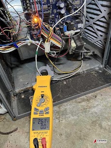 Showing precise on-site diagnostics, Cardinal Plumbing Heating & Air Inc demonstrates careful HVAC testing to ensure efficient system performance.