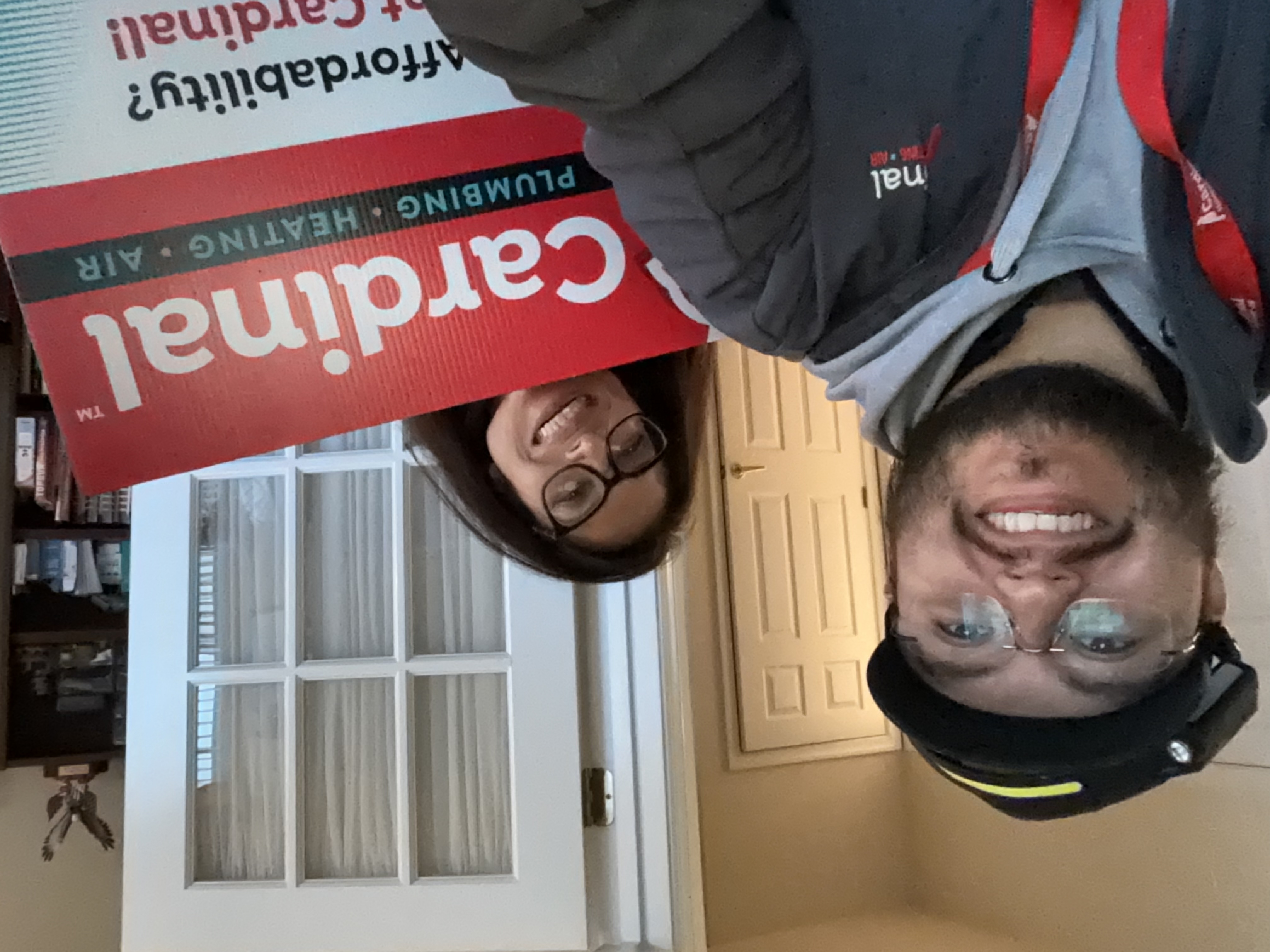 Smiling team members deliver friendly, professional service inside your home, showcasing Cardinal Plumbing Heating & Air Inc for trusted local care.