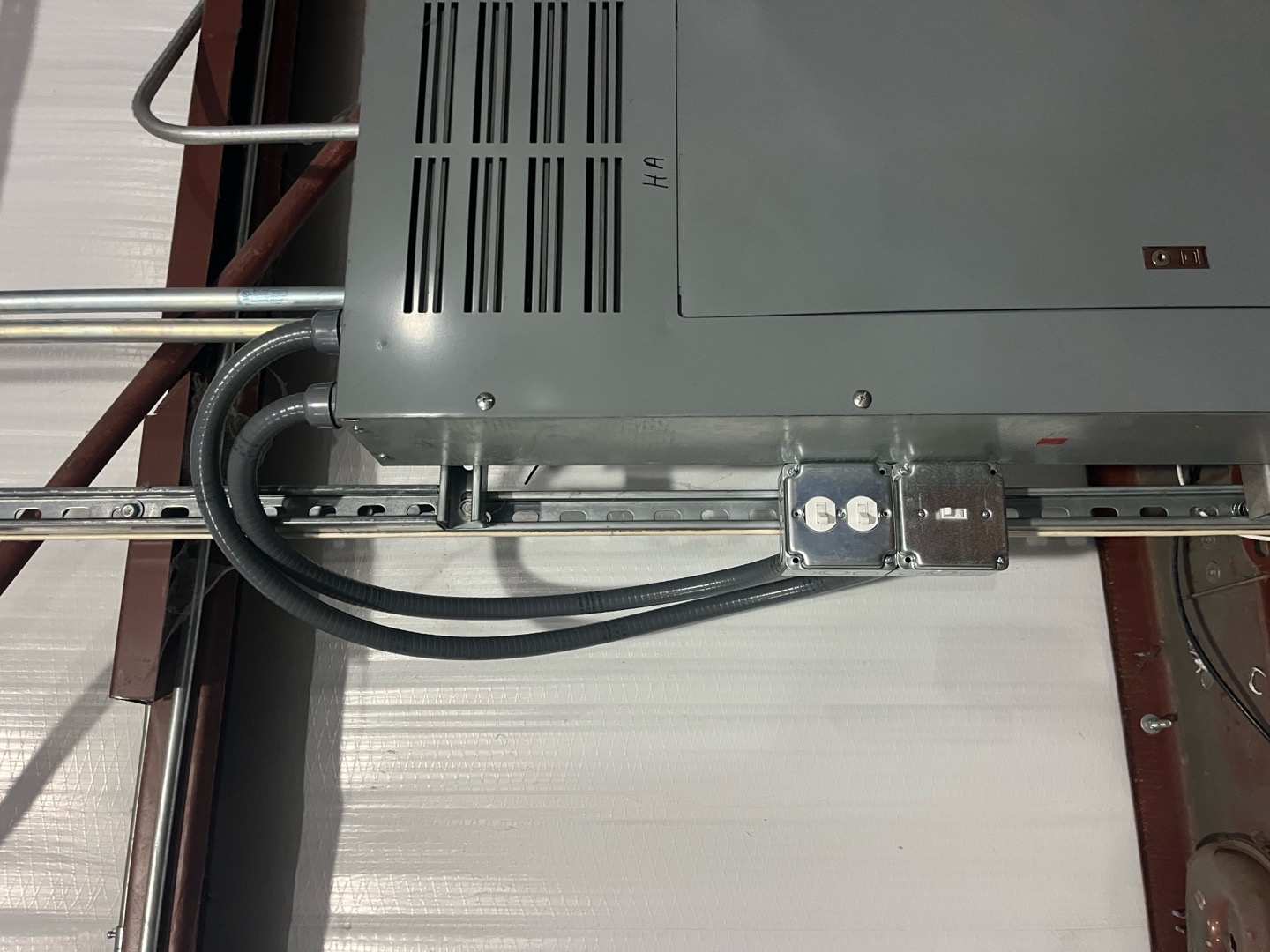 Atomic Electric Service Inc. demonstrates reliable, professional electrical installations with tidy conduit runs and secure panel work for commercial spaces.