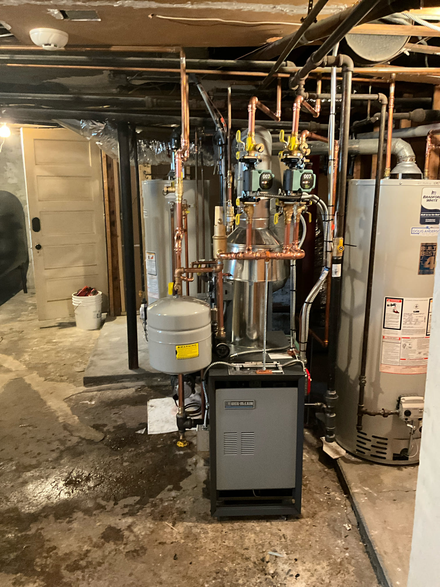 Akian Plumbing, Heating, Cooling & Electric ensures efficient heating solutions with expertly installed systems right in your home basement.