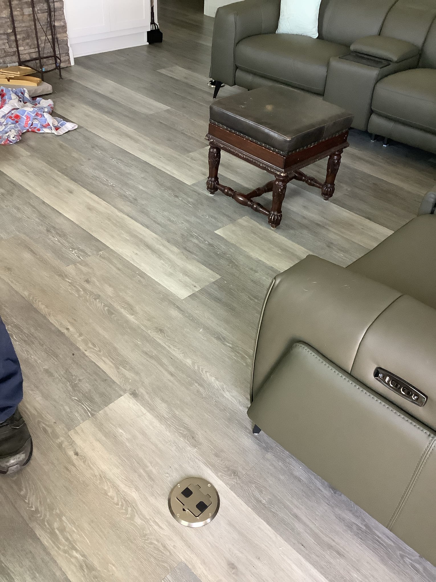 Powell Electric added a convenient recessed floor outlet and finished the installation cleanly to enhance everyday living convenience.