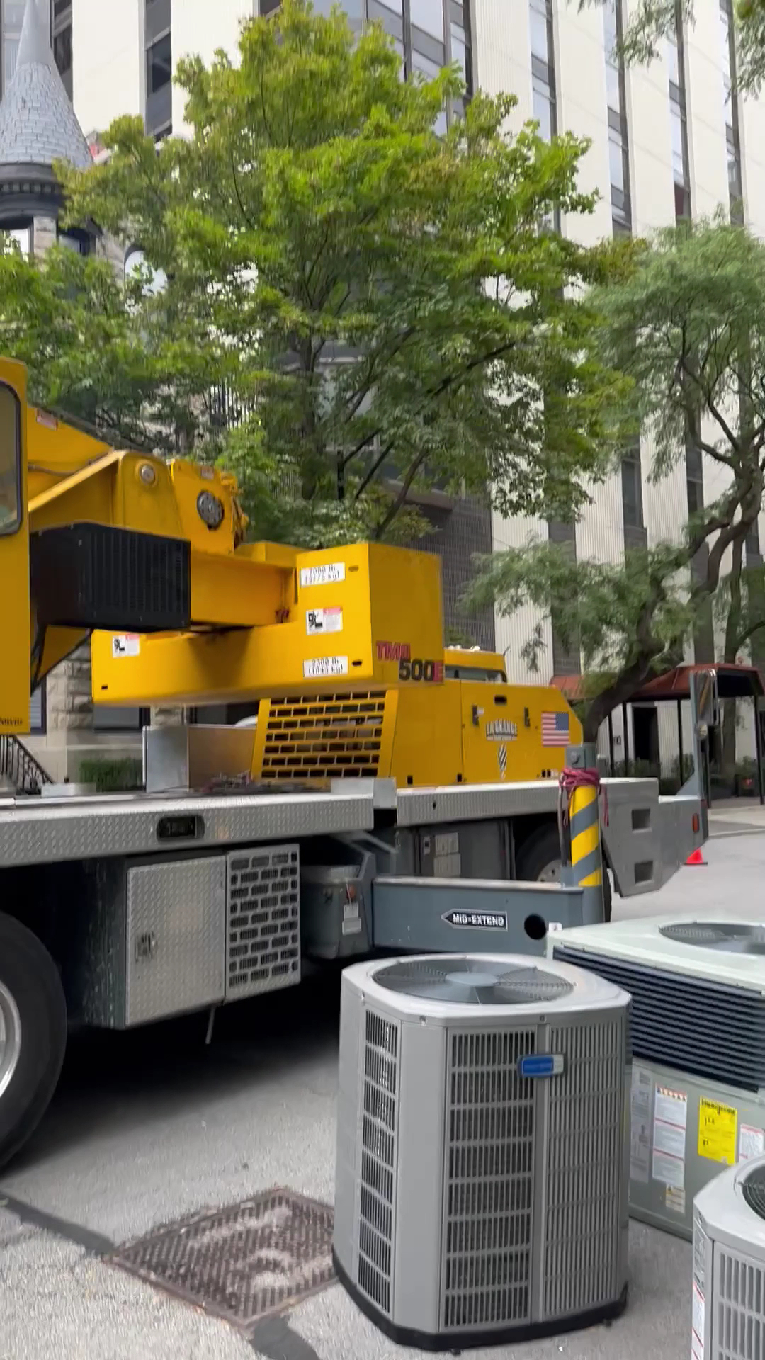 Oasis Heating and Cooling demonstrates dependable commercial HVAC installation with careful crane lifting and neatly staged outdoor units for minimal disruption.