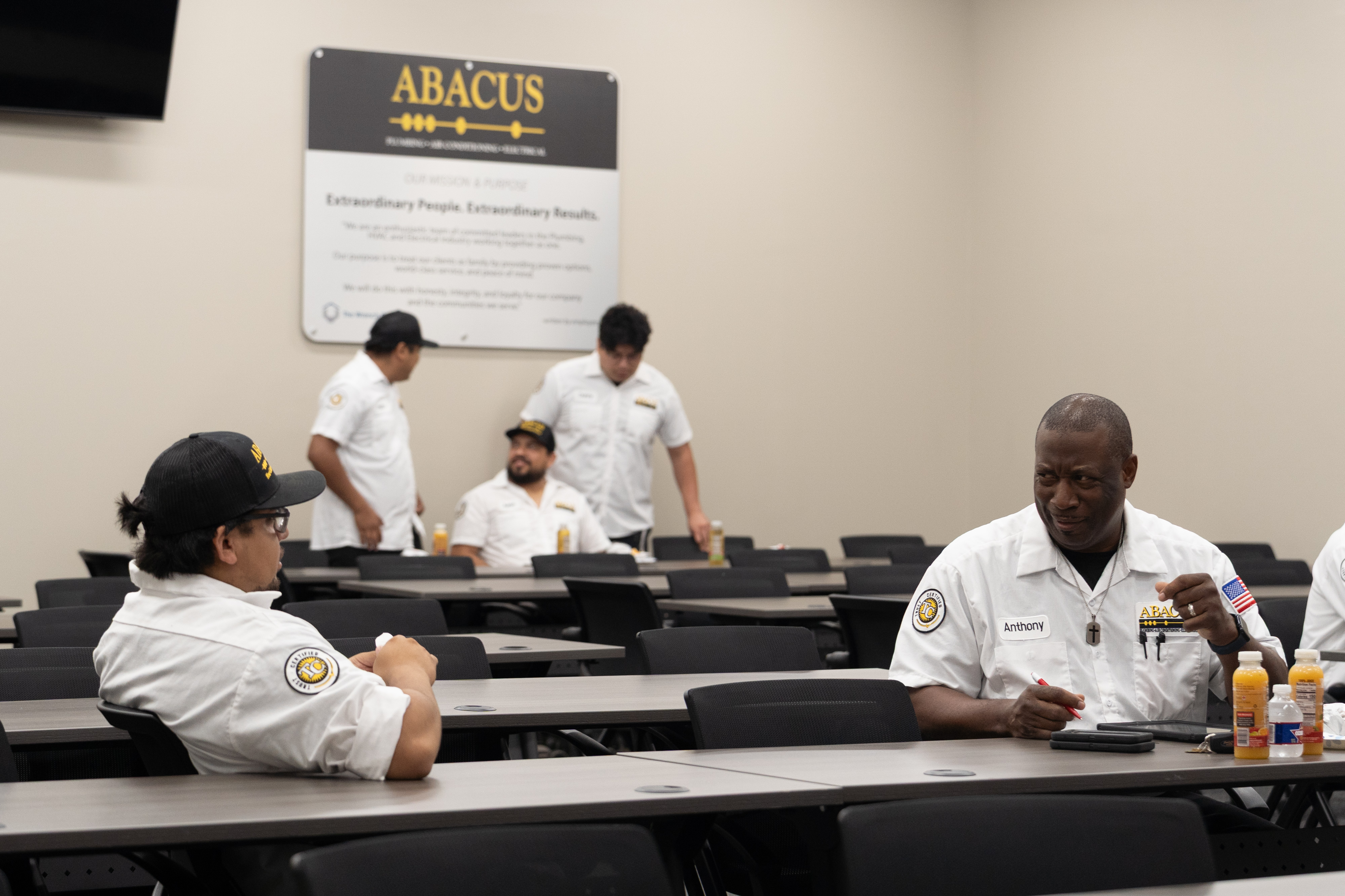 Team training and consistent branding showcase Abacus Plumbing, Air Conditioning, & Electrical's commitment to professional, reliable service.