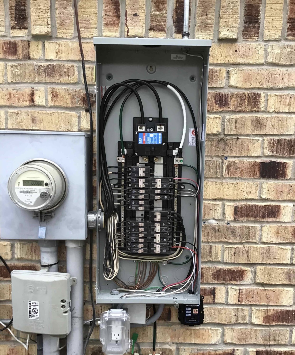 Clean, organized electrical service work on a residential exterior showcases the professionalism customers expect from Abacus Plumbing, Air Conditioning & Electrical.