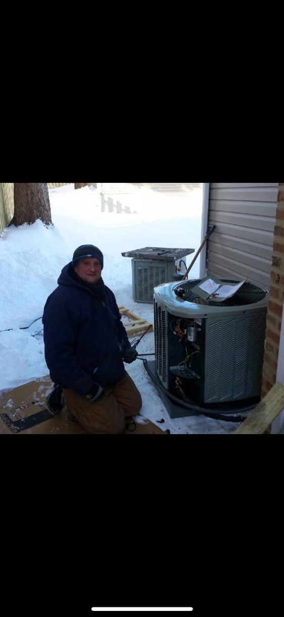 Working through winter to keep homes comfortable, Oasis Heating and Cooling shows dependable service and skilled HVAC care on-site.
