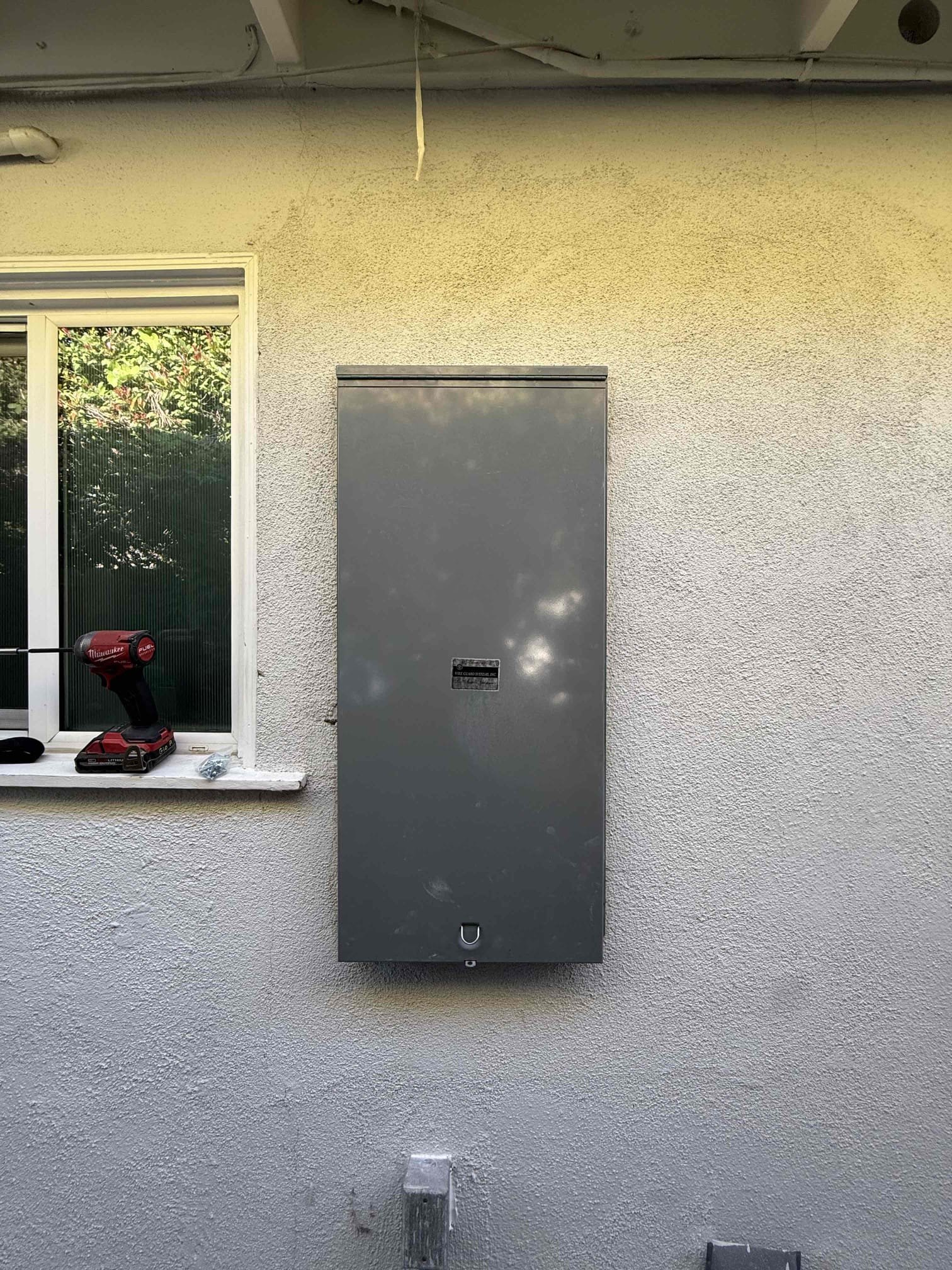 Powell Electric demonstrates careful, professional exterior panel installation that prioritizes neat workmanship and customer confidence.