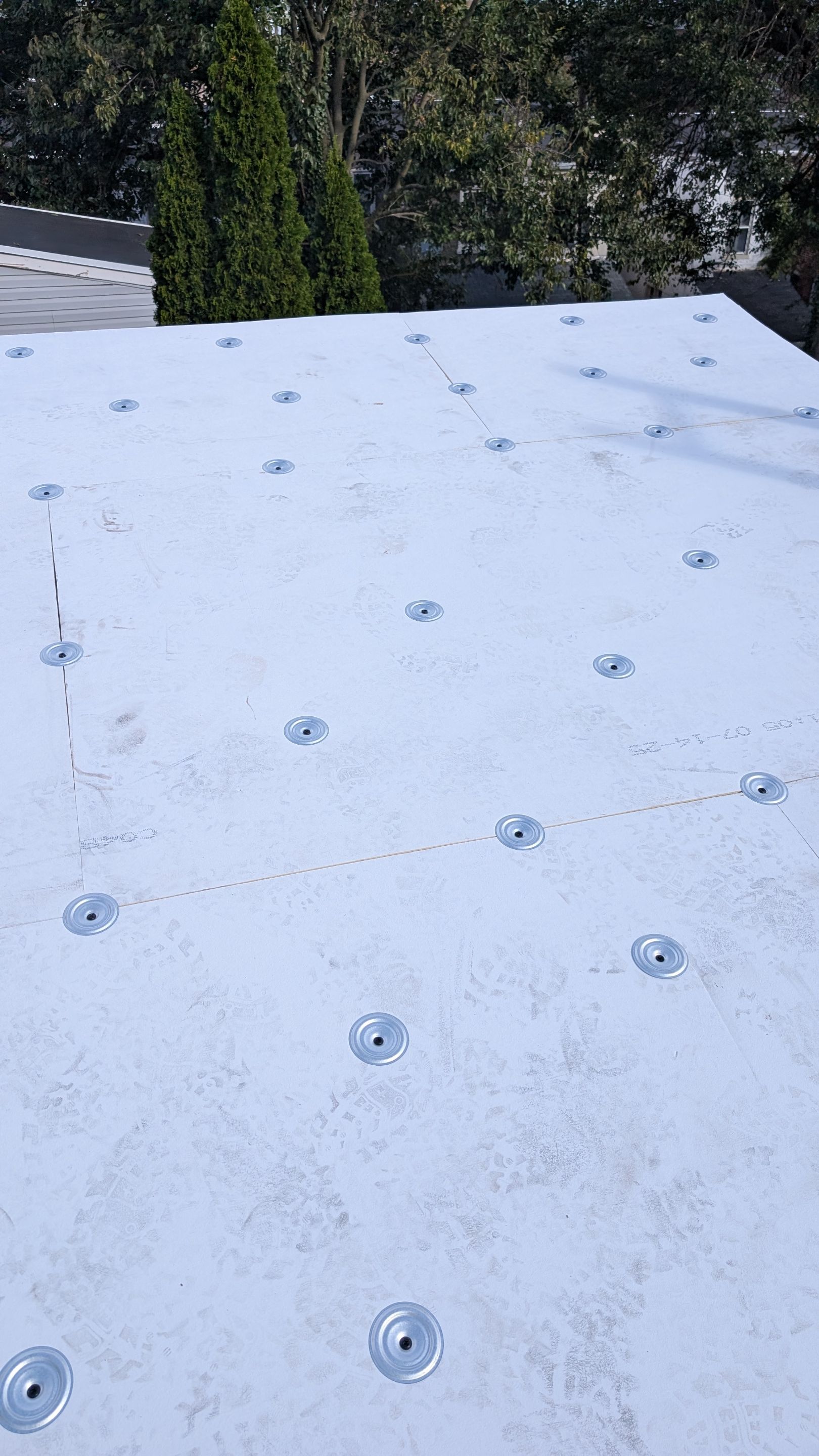 Confident craftsmanship and durable membrane installation on this flat roof showcase Mosaic Roofing & Exteriors commitment to long-lasting protection.