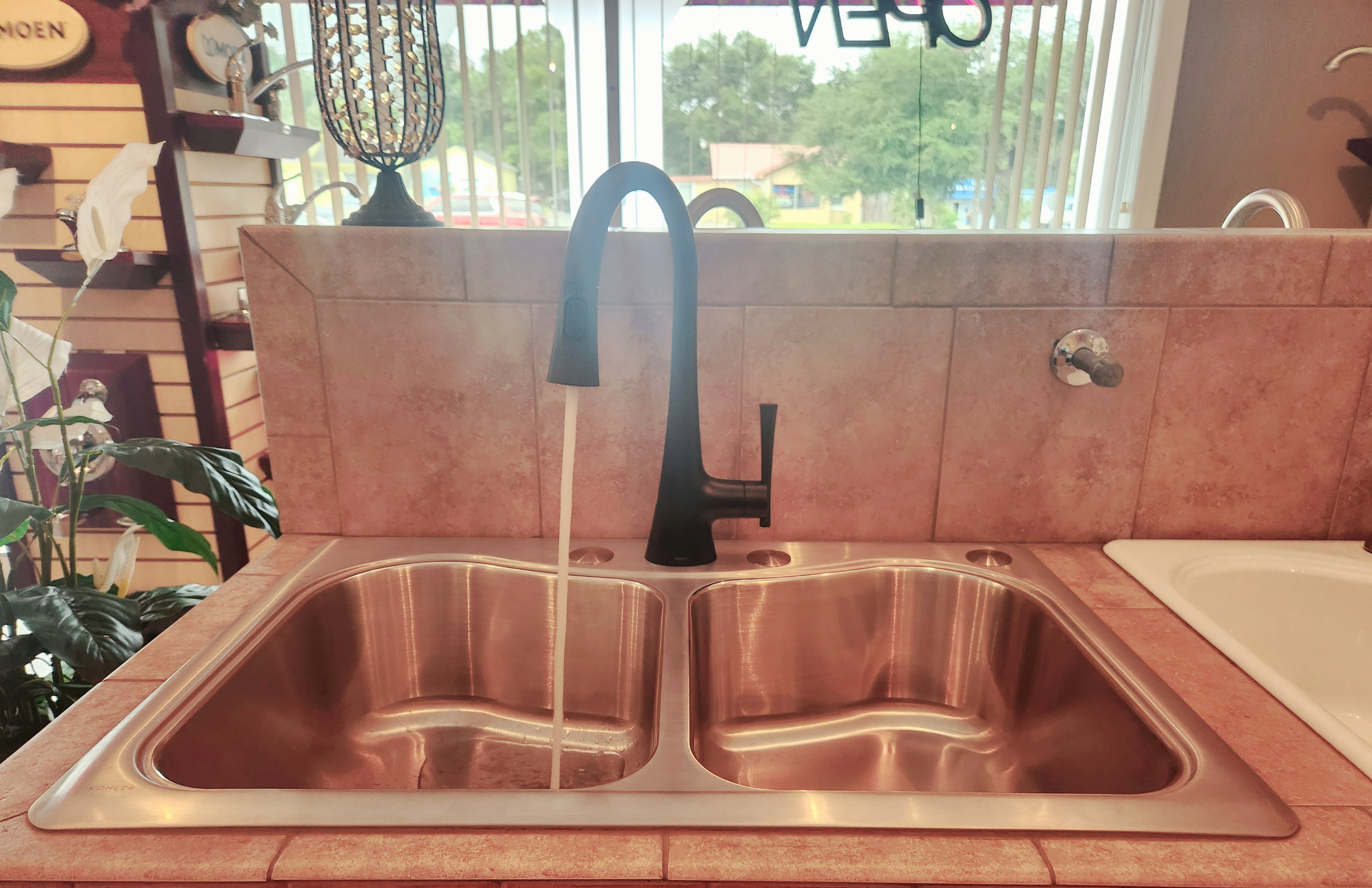 Enhance your kitchen's elegance with Alternate Design Plumbing, Inc.'s top-quality sink and faucet solutions.