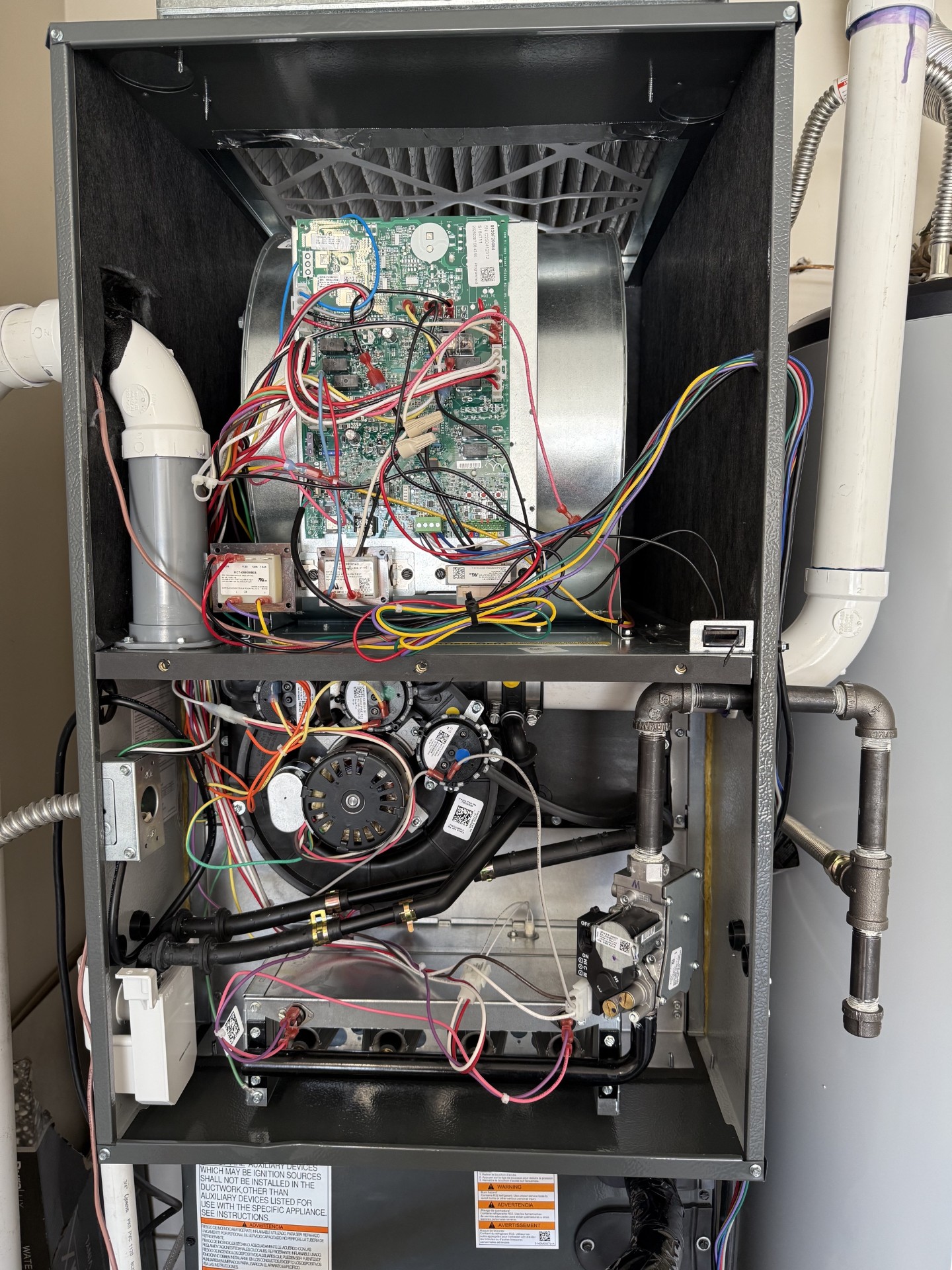 Home Heating & Air Conditioning shows meticulous workmanship and tidy wiring inside this furnace to ensure reliable, long lasting home comfort.