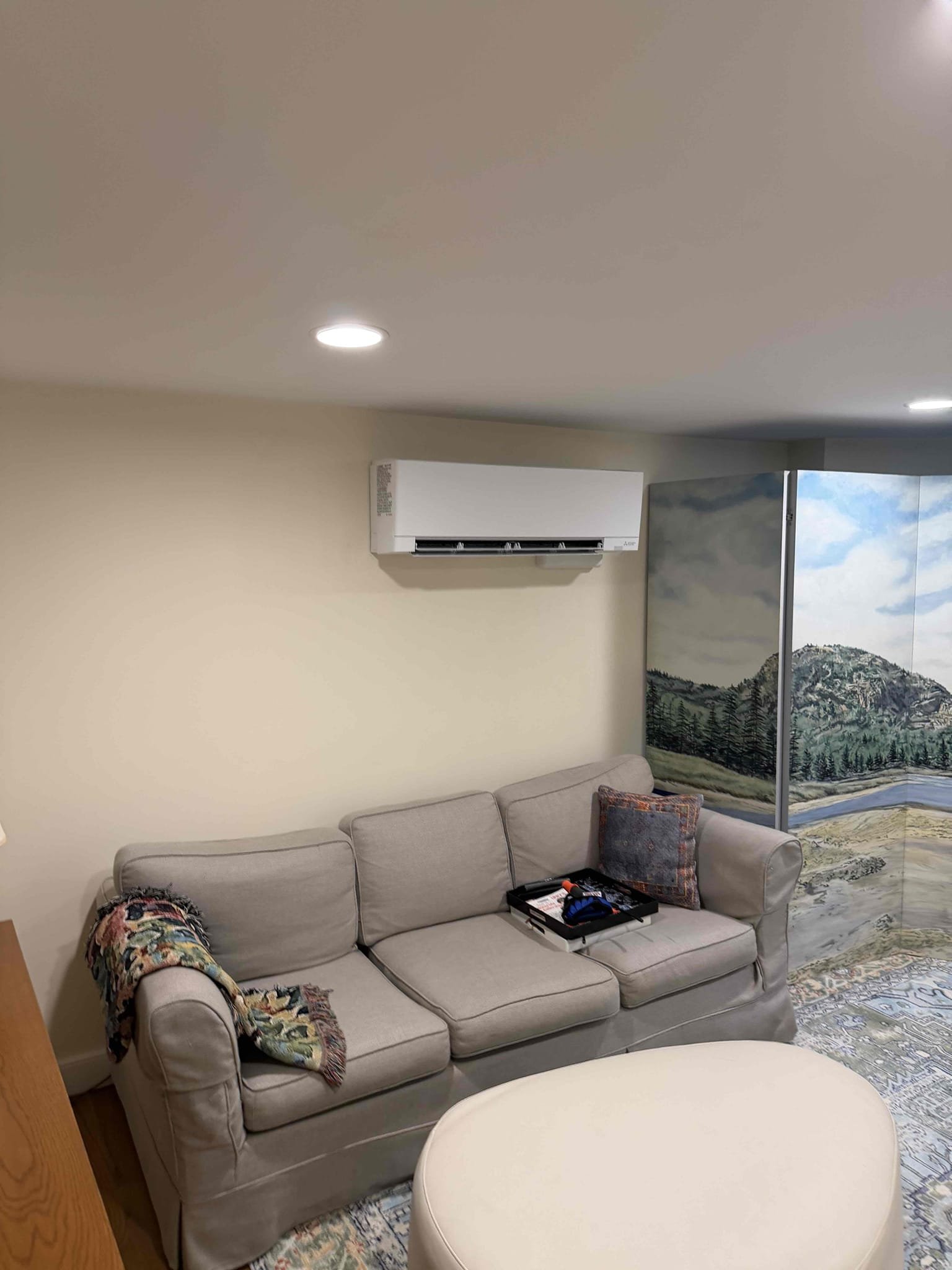 Akian Plumbing, Heating, Cooling & Electric installed a discreet ductless mini-split that keeps this living space comfortable while preserving its clean, finished look.