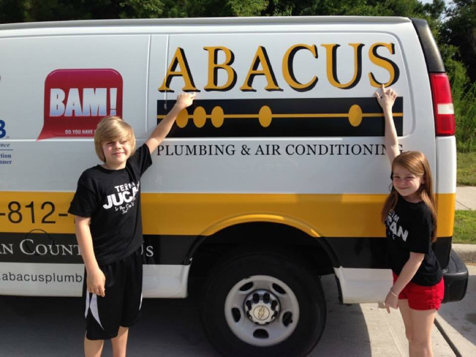 Friendly community service and clear branding show Abacus Plumbing, Air Conditioning & Electrical as a professional, trusted local choice for home service needs.