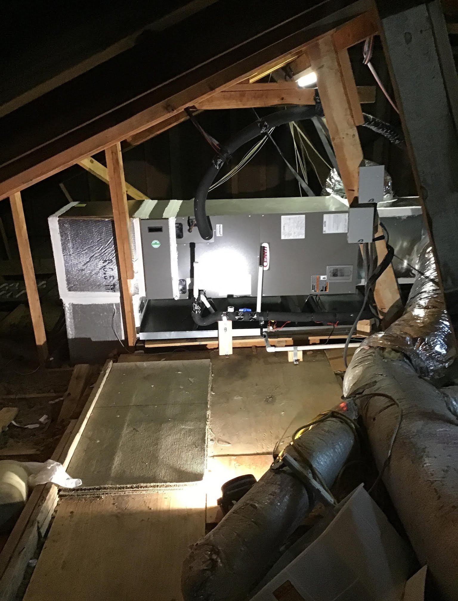 Clean, reliable HVAC installation in a tight attic space shows the craftsmanship customers rely on from Abacus Plumbing, Air Conditioning & Electrical.