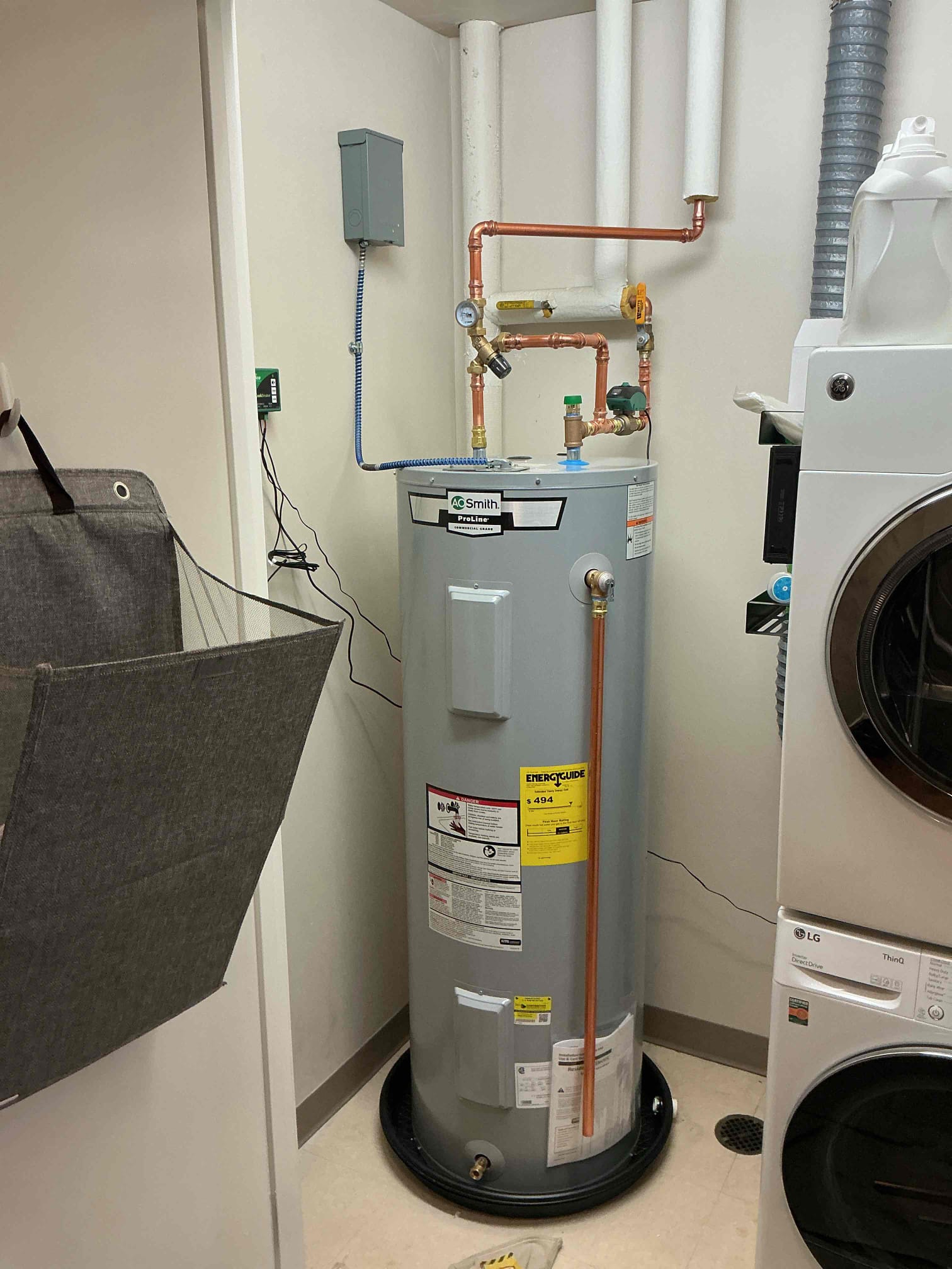 A clean, professionally installed water heater and copper plumbing show Akian Plumbing, Heating, Cooling & Electric delivering reliable, durable service.
