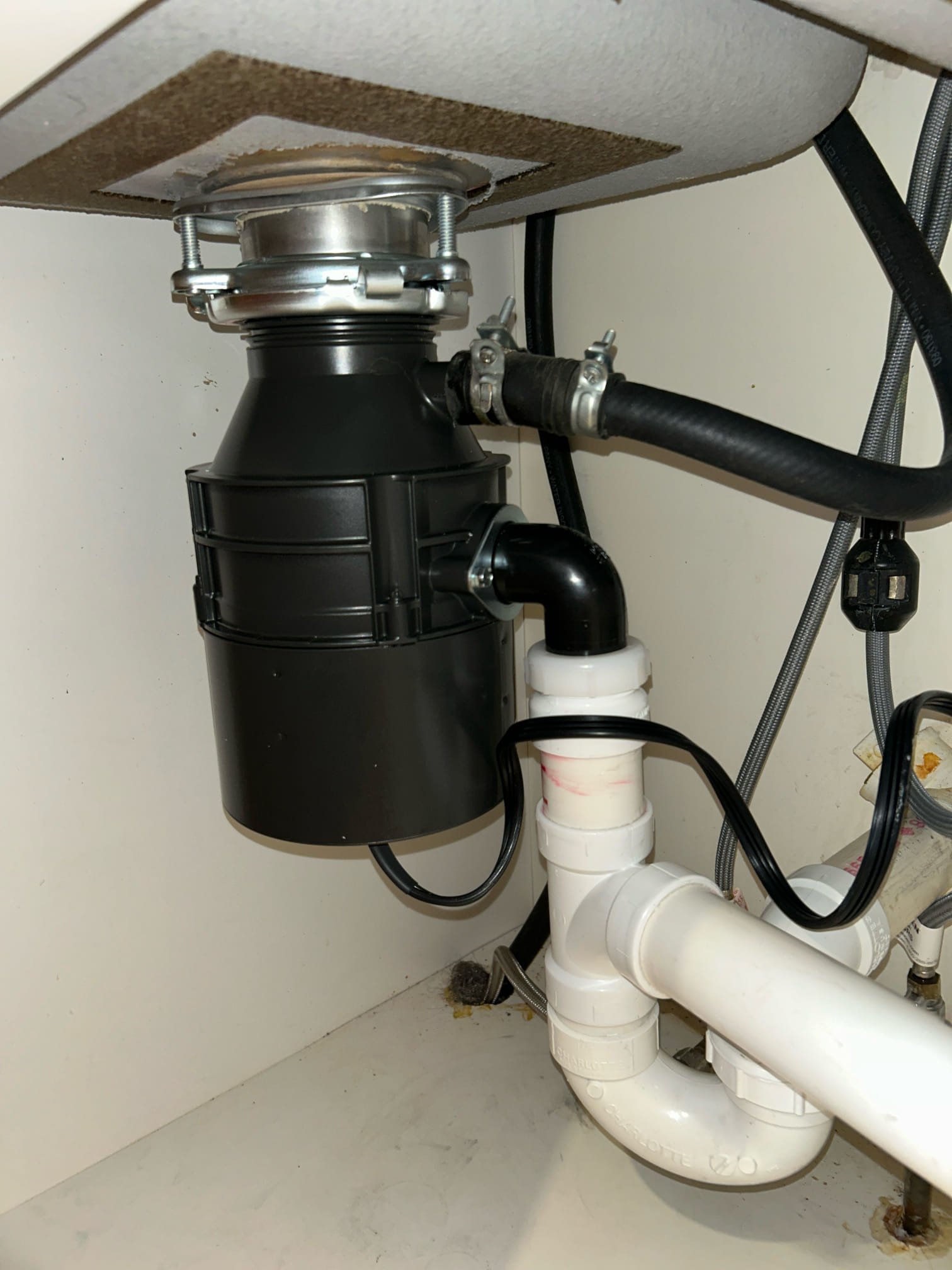 Experience seamless and professional plumbing services with Akian Plumbing, Heating, Cooling & Electric, where quality installations like this efficient garbage disposal are standard.