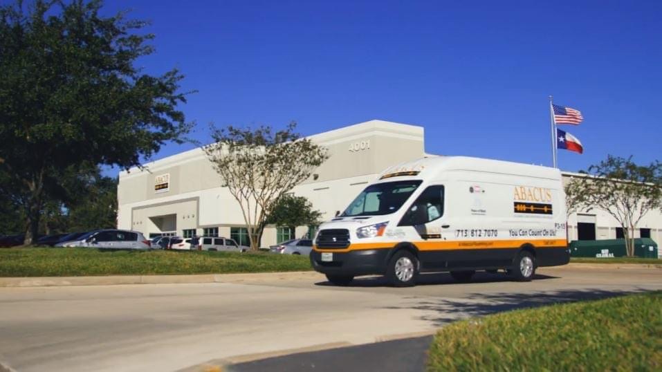 A clean Abacus Plumbing, Air Conditioning & Electrical service van arriving on site conveys dependable, professional service you can trust.