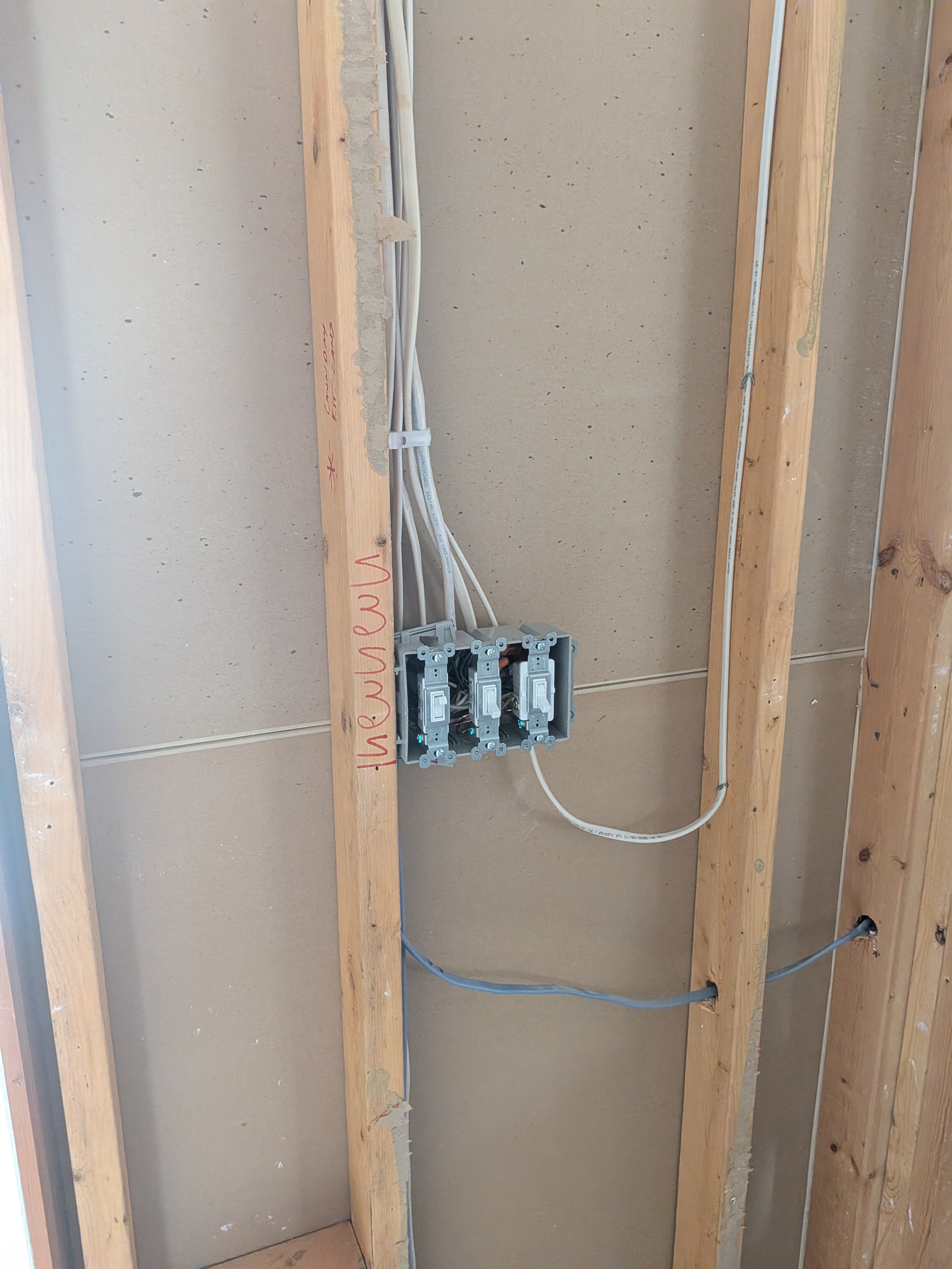 Clean rough-in wiring and organized switch installation highlight the professional craftsmanship customers expect from Dawson's Electric & Air.