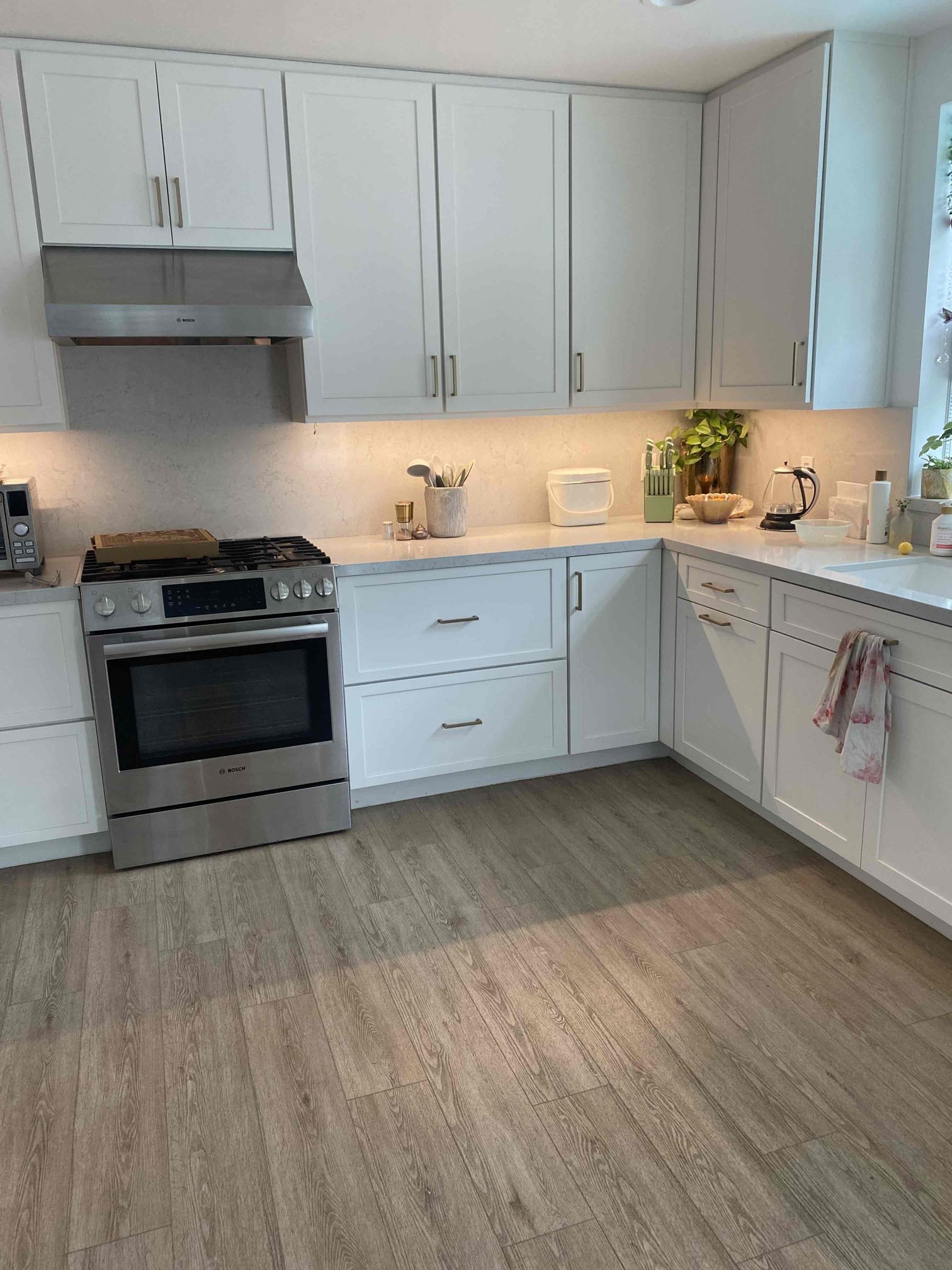 A spotless, well-lit kitchen showcases Powell Electric's commitment to safe, professional electrical installations that enhance home value.