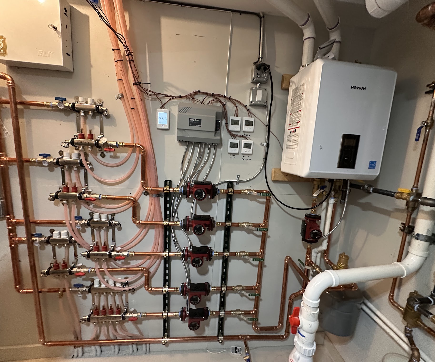 A clean, professionally installed hydronic system shows Oasis Heating and Cooling's meticulous craftsmanship for reliable home comfort.