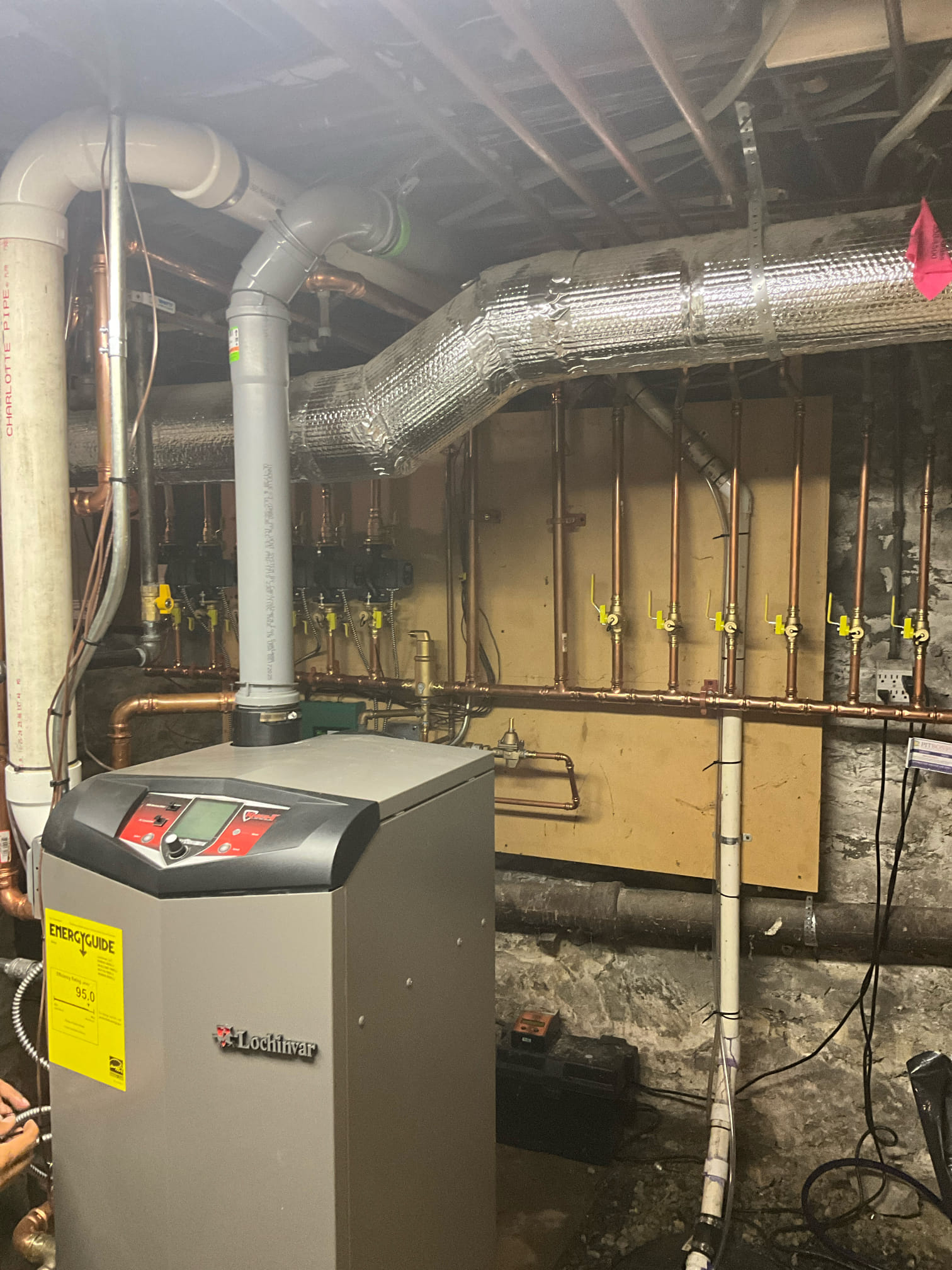 Akian Plumbing, Heating, Cooling & Electric installed this tidy boiler and manifold to deliver reliable heating and long-term value for homeowners.