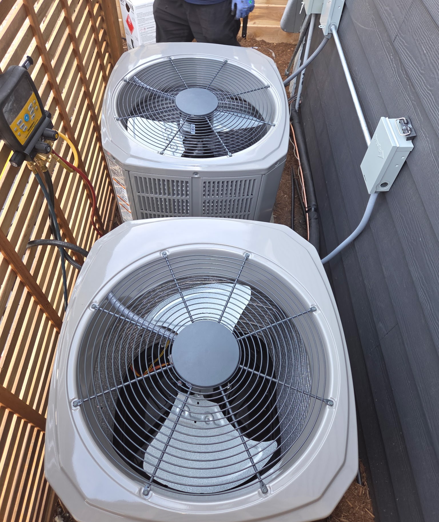 Neat, professional installation and testing of outdoor units shows Oasis Heating and Cooling’s commitment to reliable, high-quality HVAC service.