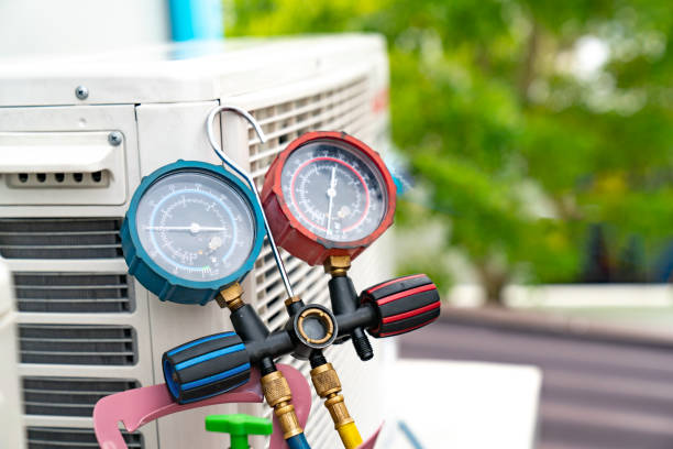 Professional HVAC diagnostics using specialized gauges to help maintain efficient heating and cooling system performance.