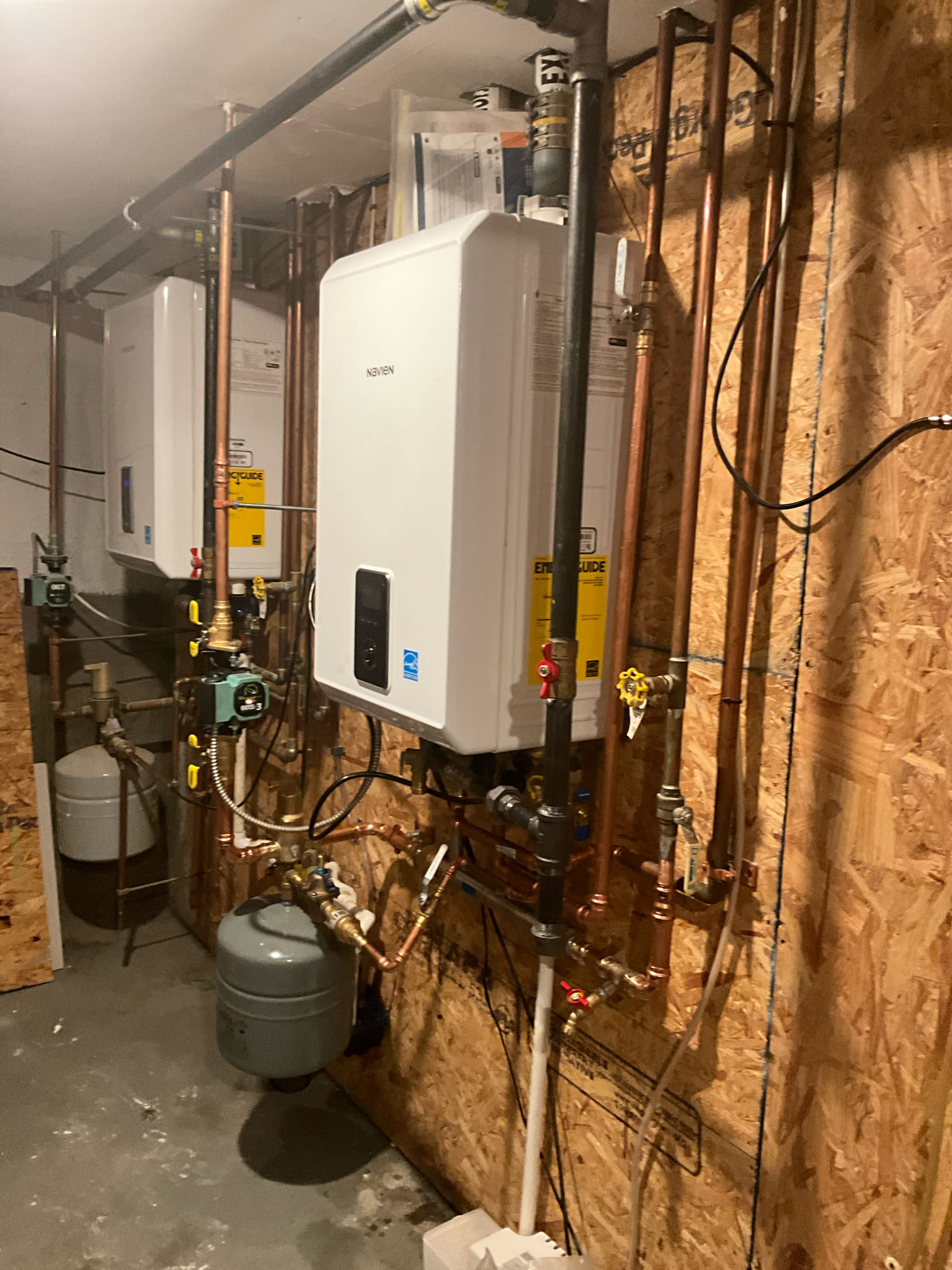 Clean, professional tankless water heater installation by Akian Plumbing, Heating, Cooling & Electric showcases reliable craftsmanship and easy maintenance.