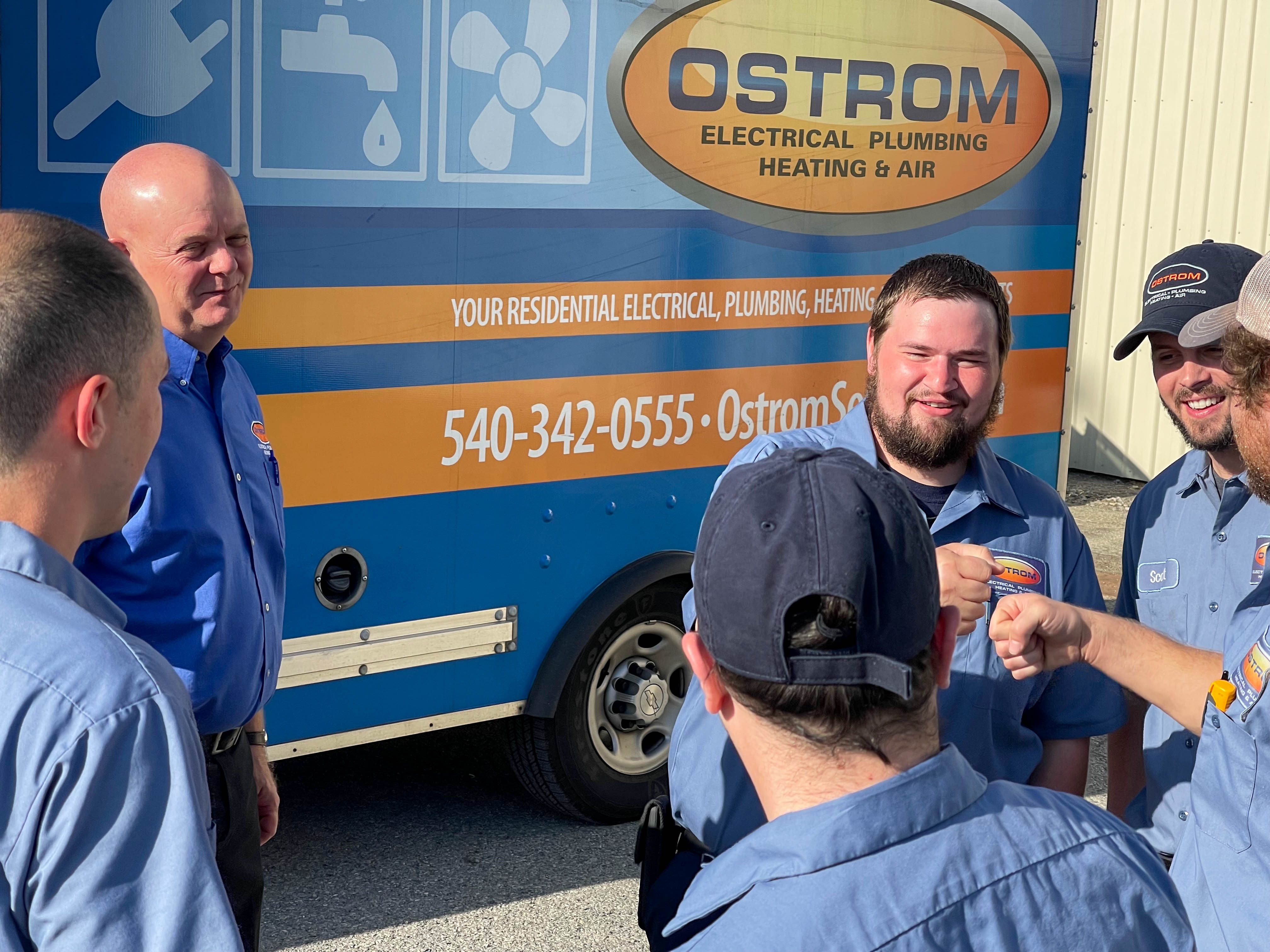 Experience top-notch service with a smile from Ostrom Electrical Plumbing Heating & Air - Your trusted residential experts!
