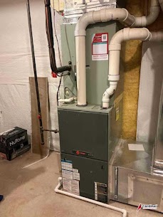 A clean, professionally installed furnace and drain setup shows the dependable craftsmanship customers trust at Cardinal Plumbing Heating & Air Inc.