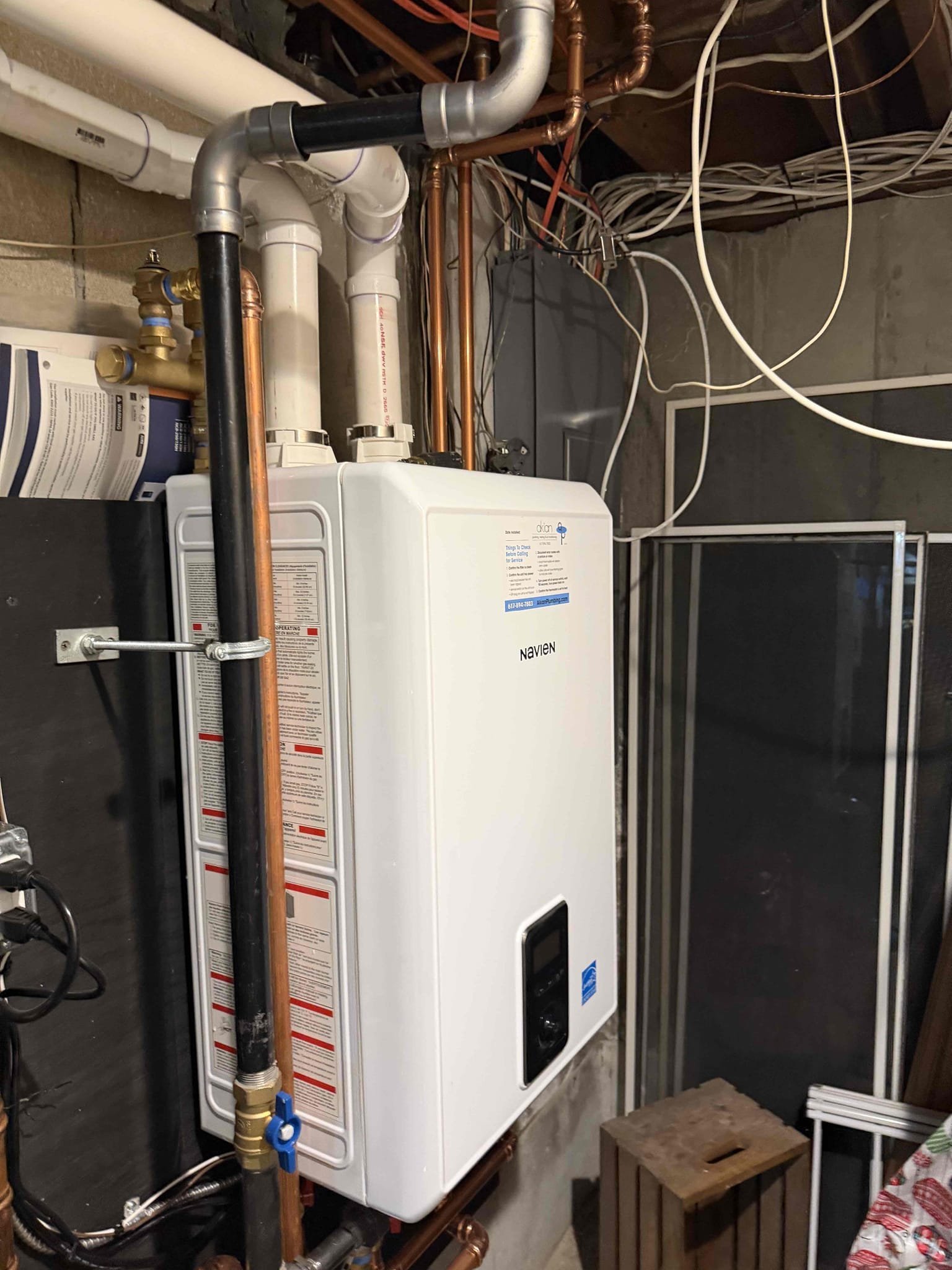 A clean, space-saving Navien installation demonstrates Akian Plumbing, Heating, Cooling & Electric’s commitment to quality and lasting value for homeowners.