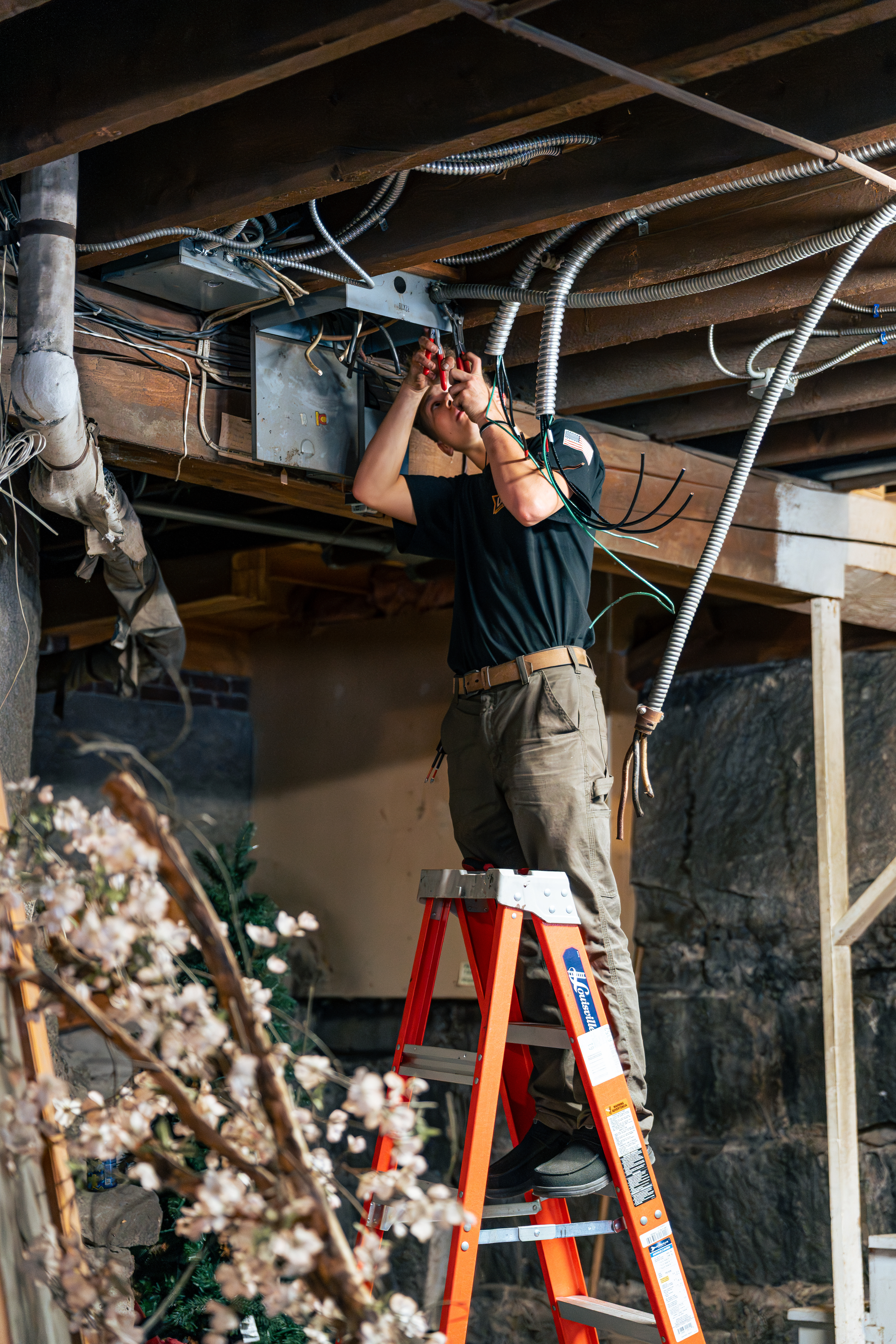 Skilled technicians from Lloyd Plumbing, Heating, Air, Electrical deliver careful electrical work in basements, demonstrating reliable craftsmanship and safety.