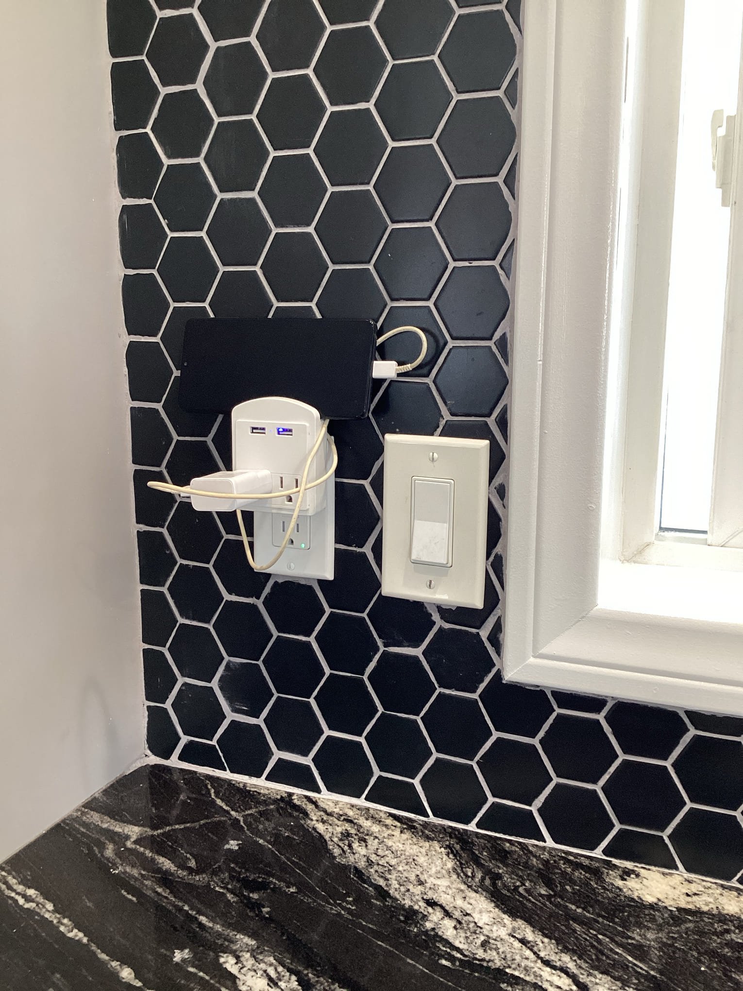 Powell Electric installed a discreet USB charging outlet that blends with modern tile, delivering reliable convenience and smart finishing.