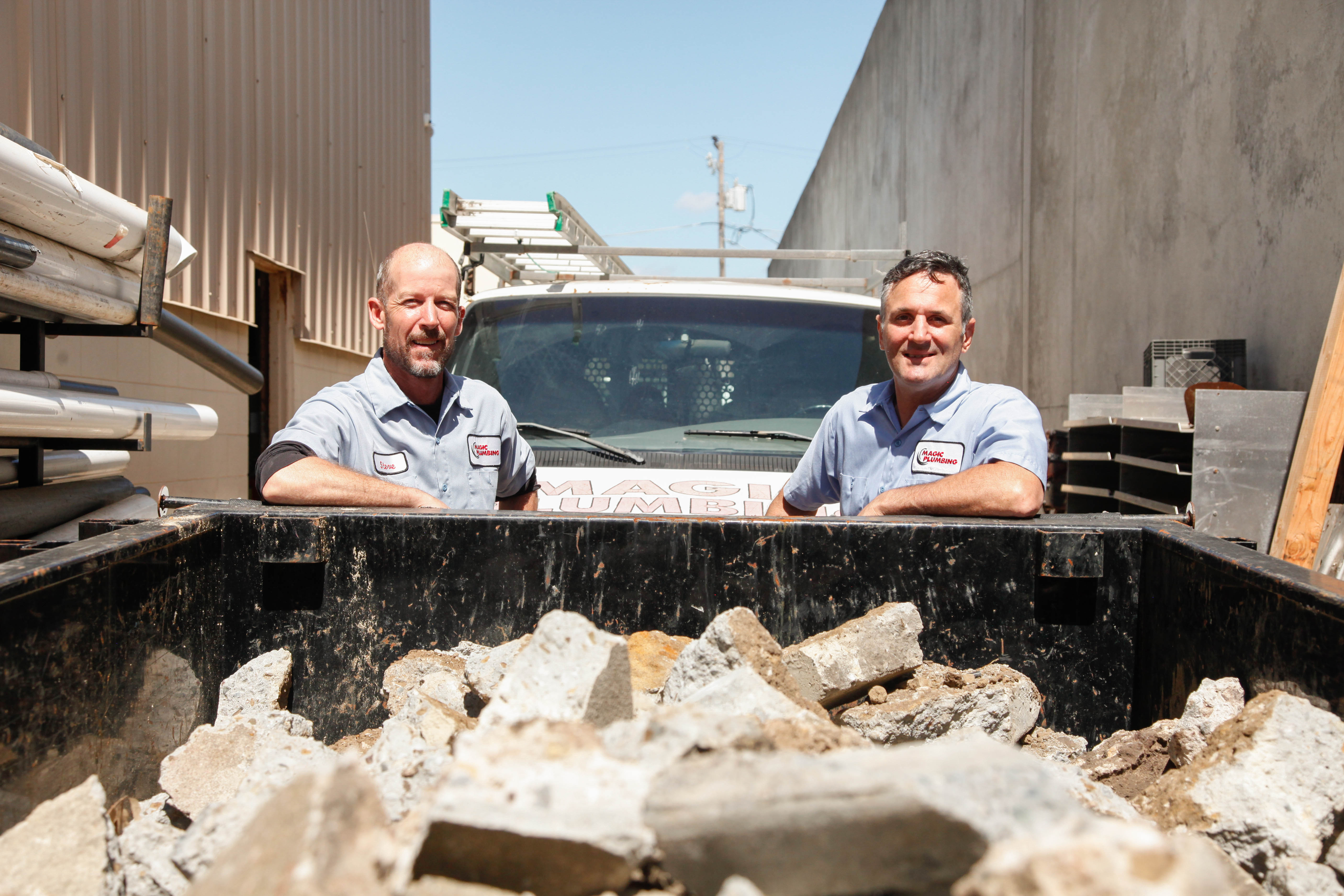 Confident and reliable on-site service, Magic Plumbing Heating & Cooling shows skilled technicians ready to handle tough plumbing jobs.