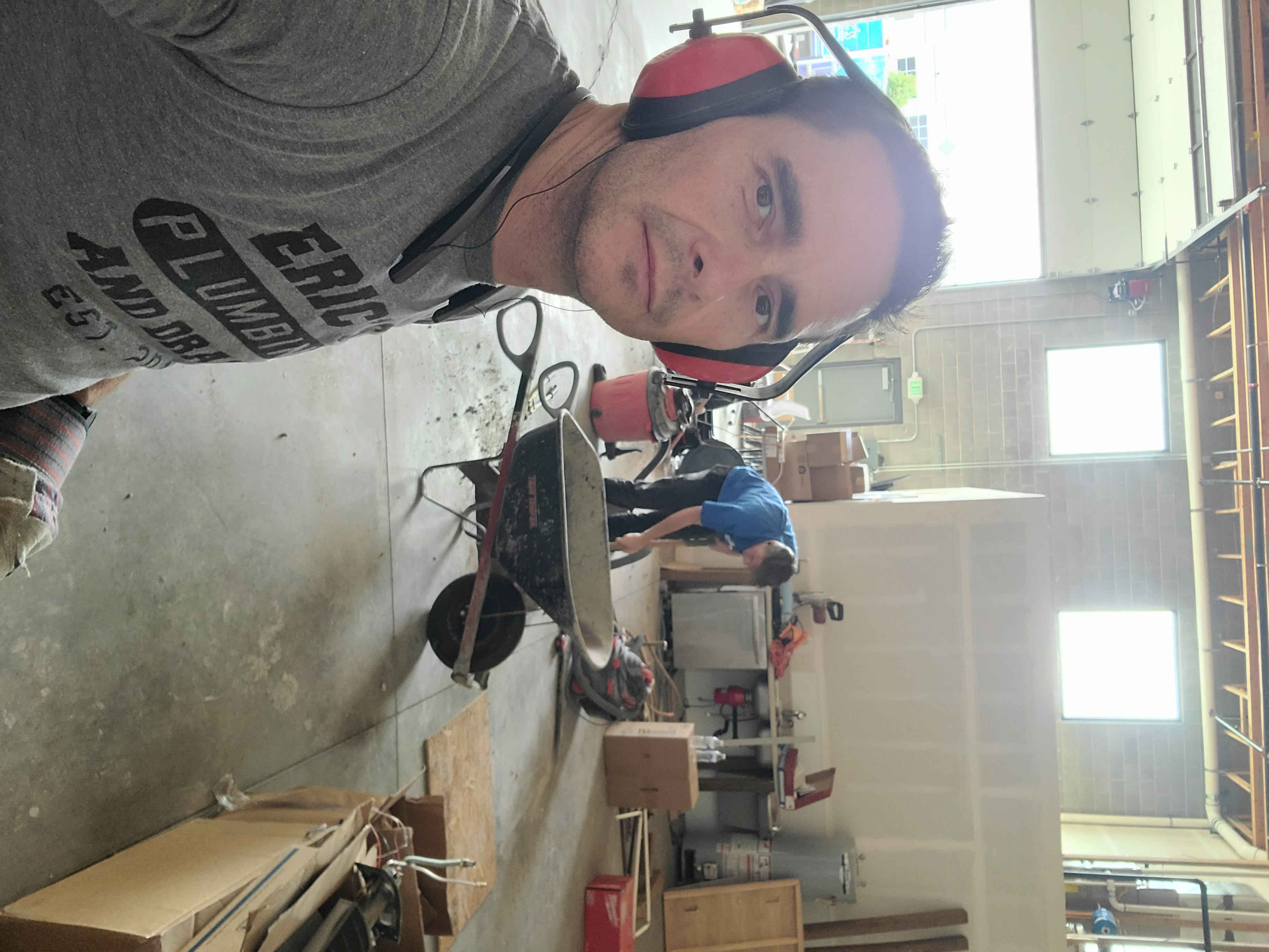 Eric's Plumbing & Drain Cleaning showcases professionalism and a variety of services in a well-equipped workspace.