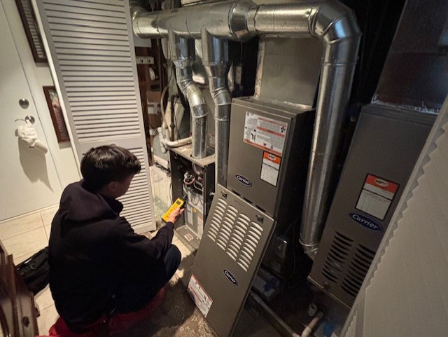 A skilled Parrish Services technician conducts thorough furnace diagnostics to ensure reliable home comfort and lasting performance.