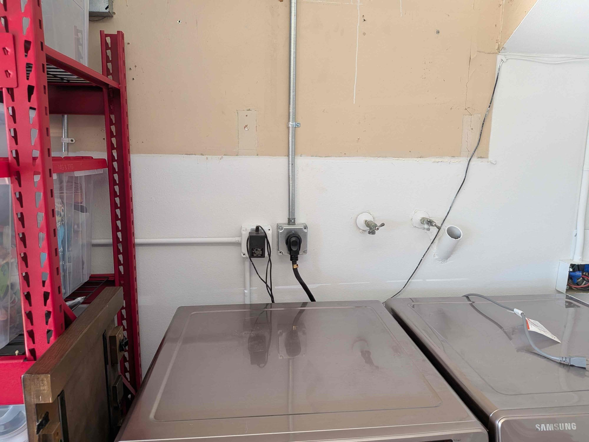 Powell Electric kept this laundry area safe and serviceable with neat conduit and a secure outlet for reliable everyday use.