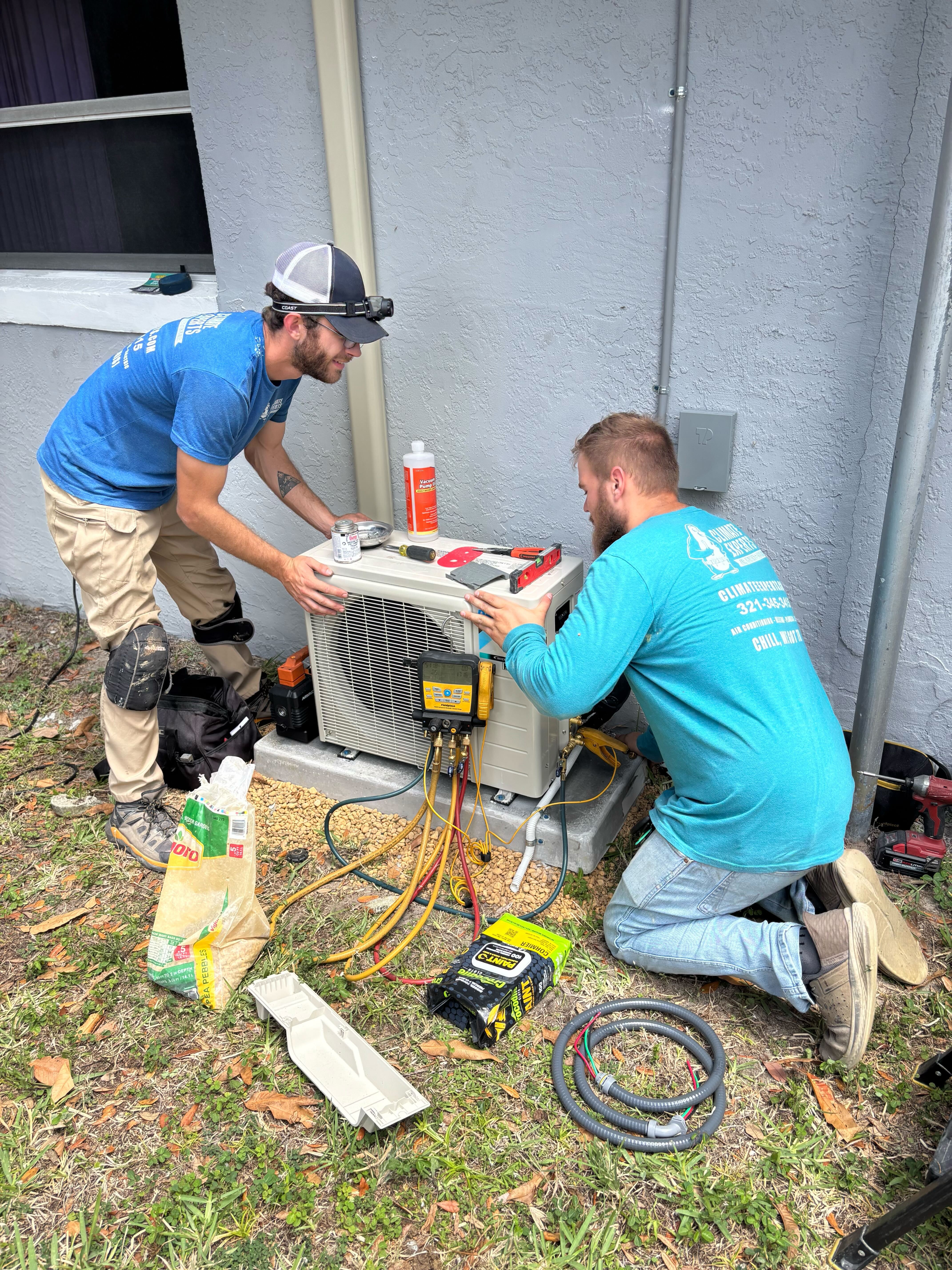 Skilled technicians from Climate Experts Air, Plumbing & Electric demonstrate careful, professional HVAC service to keep your system running reliably.
