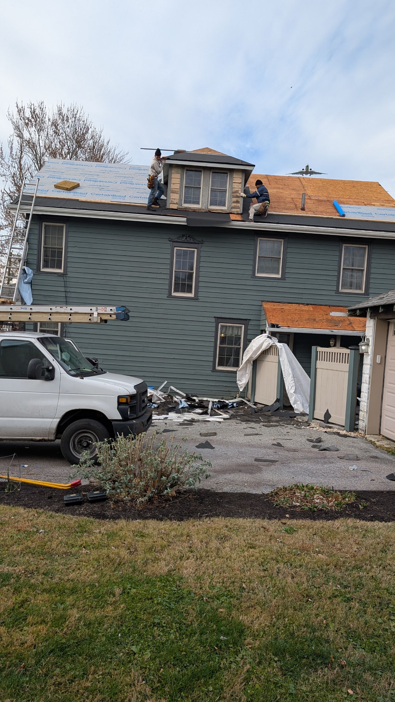 Skilled crews from Mosaic Roofing & Exteriors are replacing this home's roof with care and efficiency, leaving durable underlayment in place.