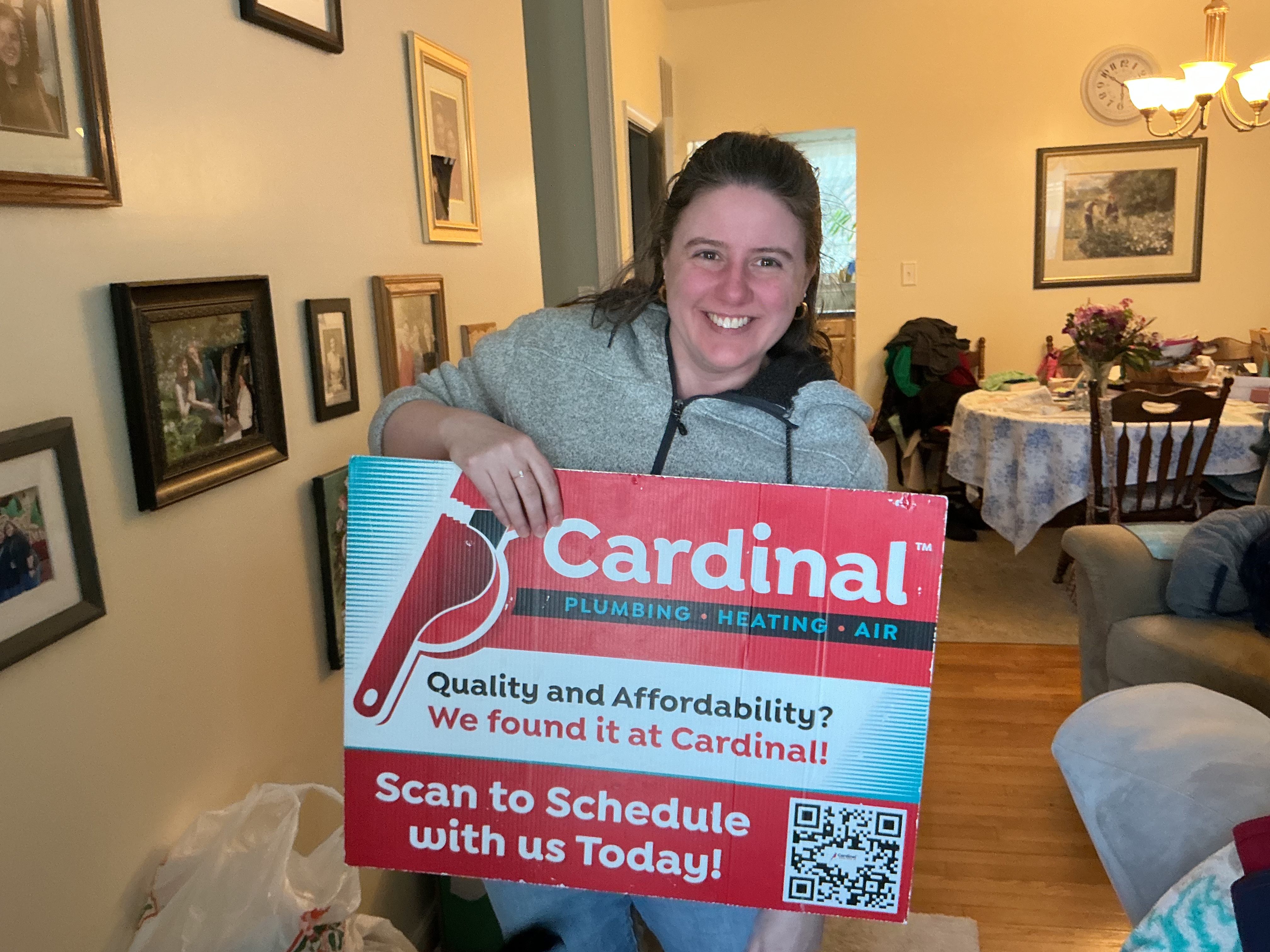 Smiling homeowners show their satisfaction after a residential service visit from Cardinal Plumbing Heating & Air Inc, highlighting trustworthy local care.