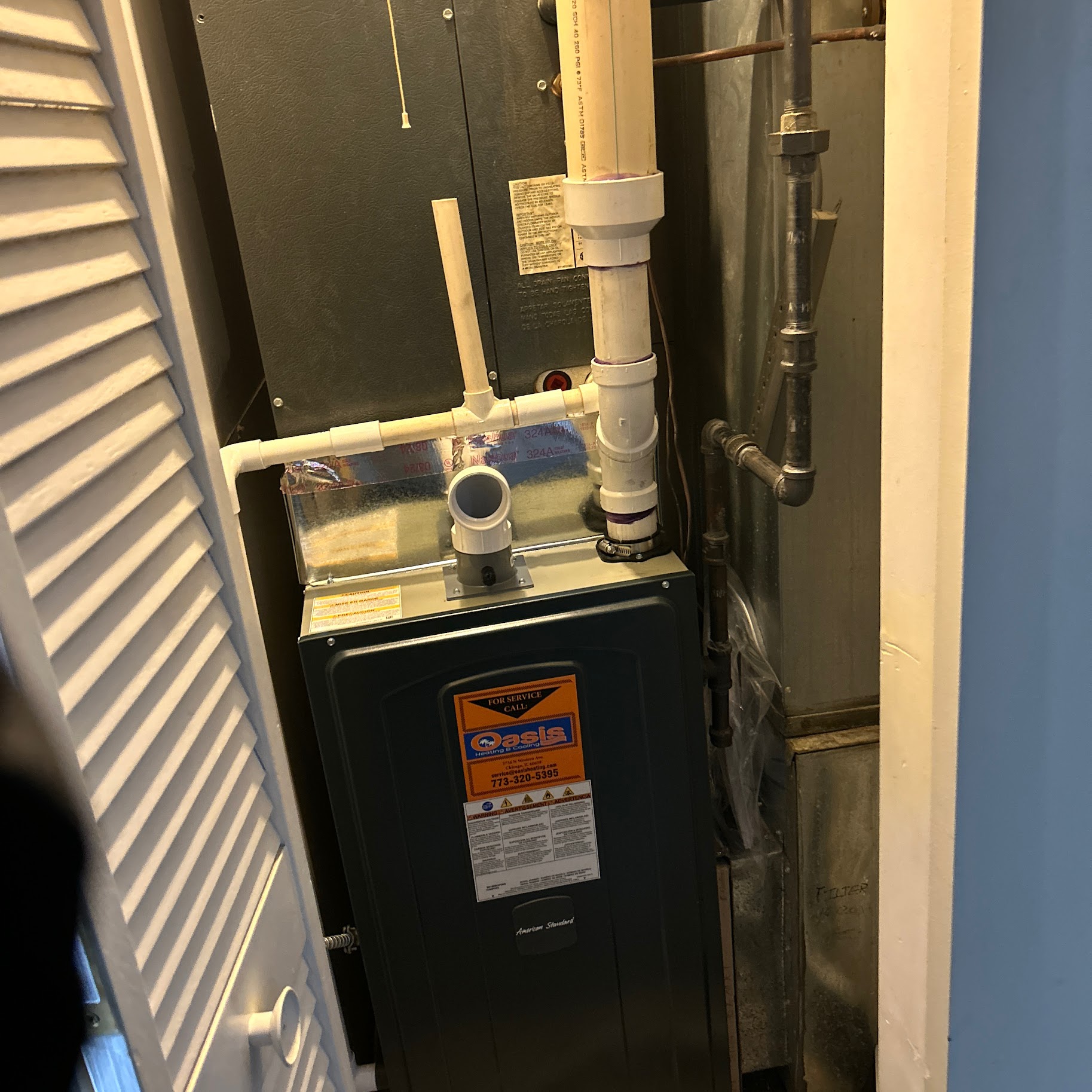 Neat, accessible installation shows the care Oasis Heating and Cooling puts into reliable HVAC service and tidy drain work.