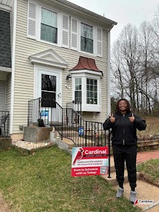 A satisfied customer shows appreciation while Cardinal Plumbing Heating & Air Inc demonstrates reliable, friendly service at home.
