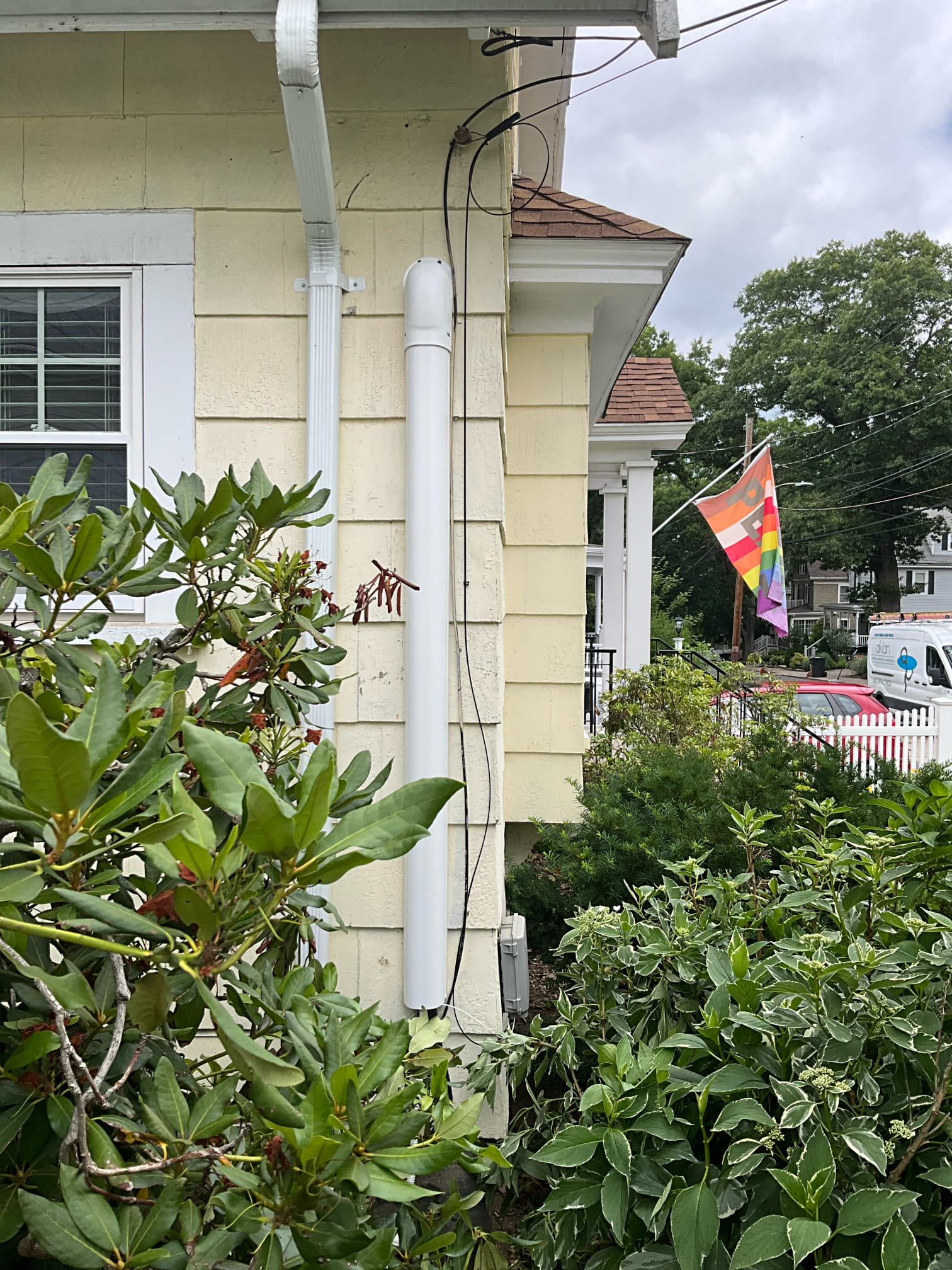 A clean, neatly routed exterior conduit shows the attention to craftsmanship homeowners trust from Akian Plumbing, Heating, Cooling & Electric.