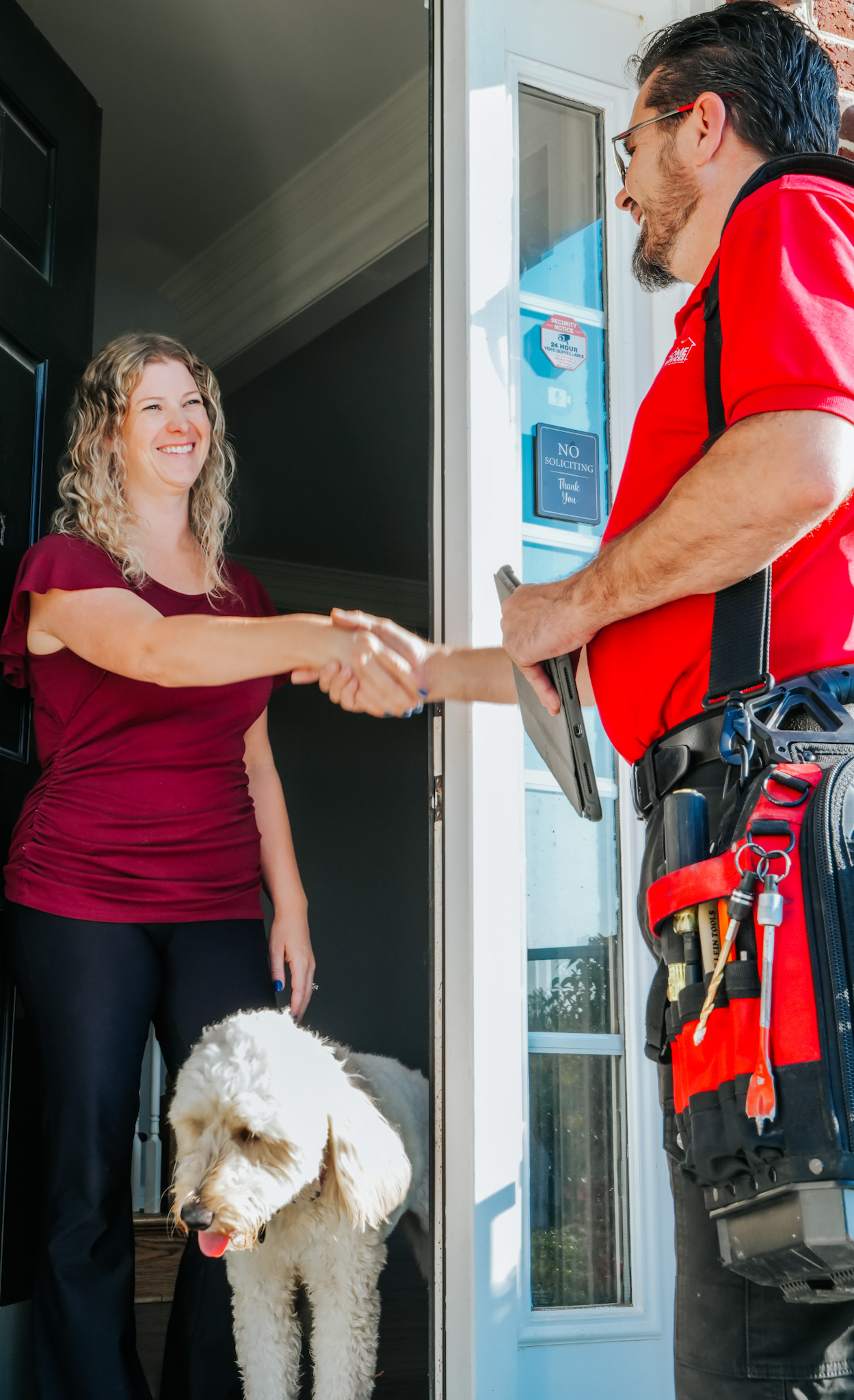 A friendly Parrish Services technician arrives with tools and a tablet, creating a professional, trustworthy home service experience.