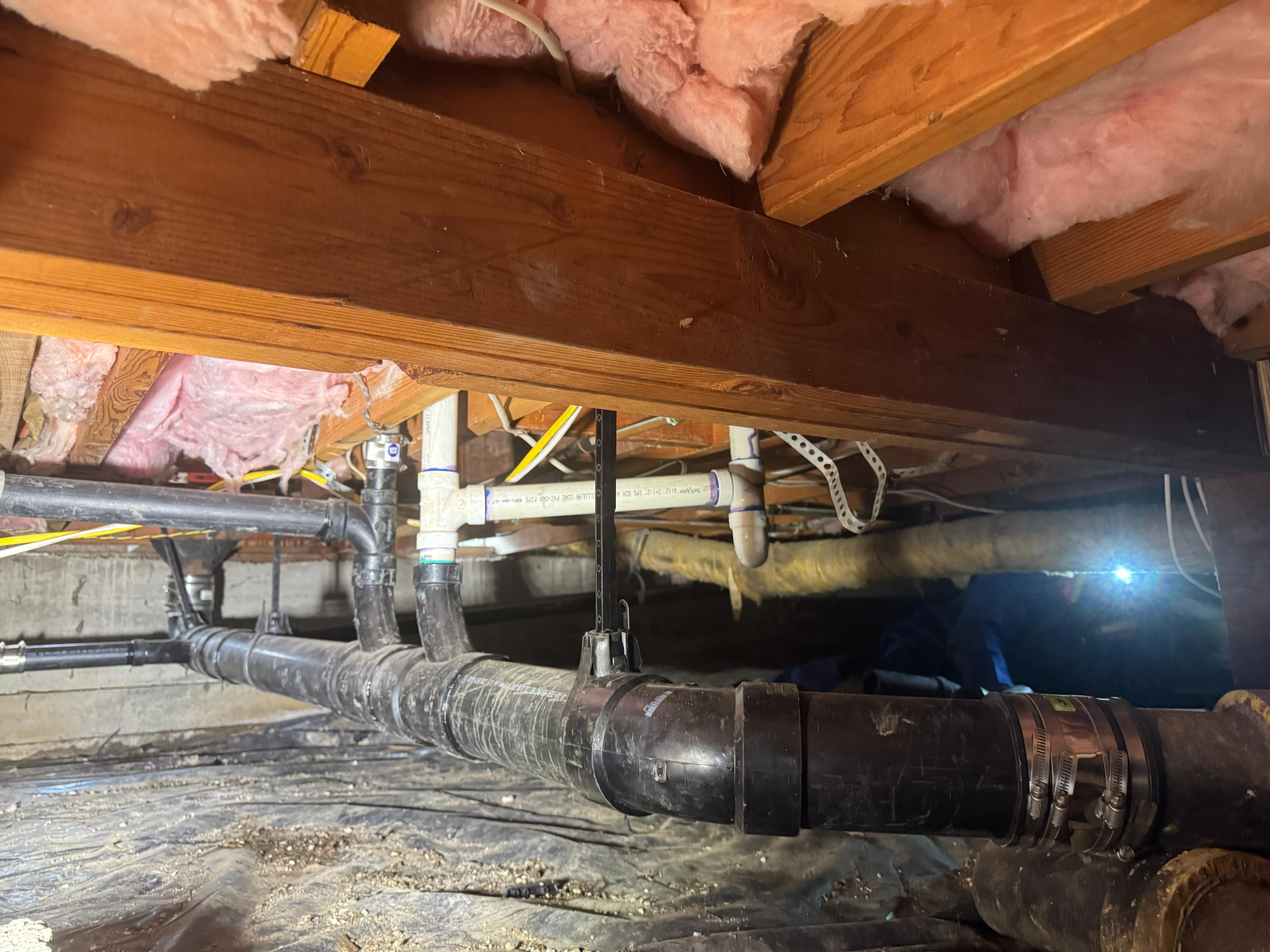 Clean, dependable drain repairs visible in this crawlspace show Big Island Plumbing’s craftsmanship and attention to leak prevention.