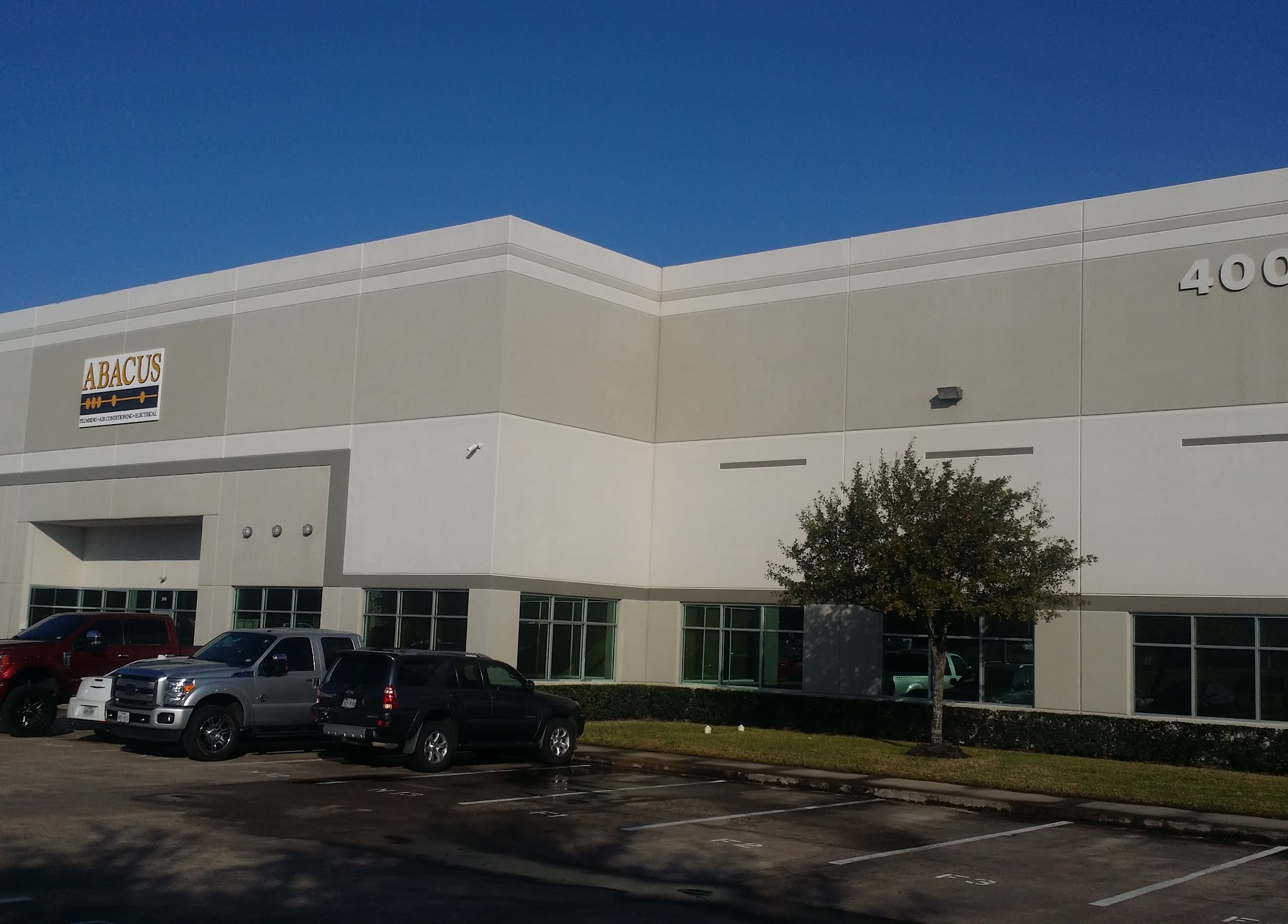 A clean, professional facility and visible fleet showcase Abacus Plumbing, Air Conditioning & Electrical reliability and readiness to serve customers.