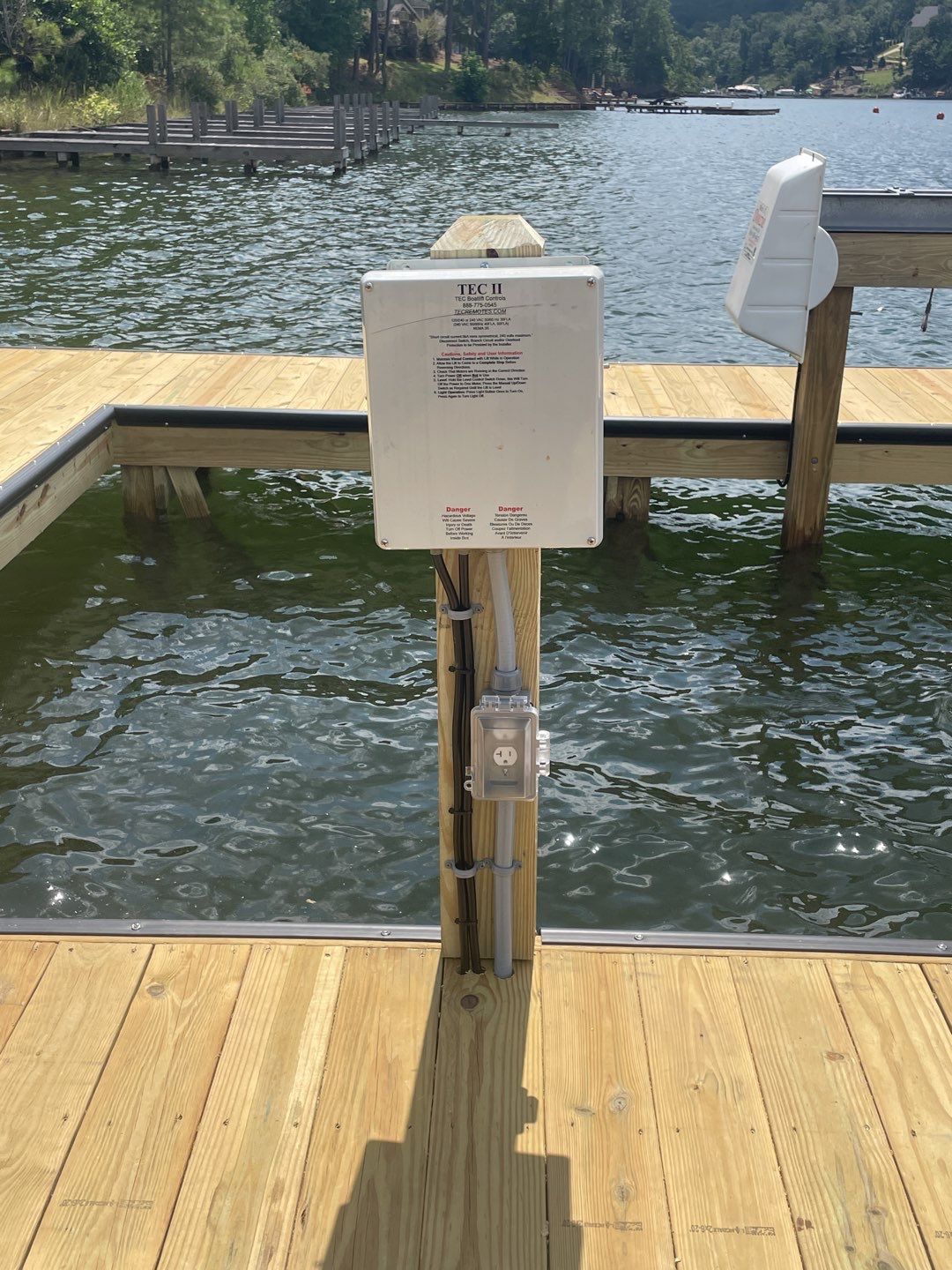 Solid, safety-focused dock wiring and weatherproof outlets show C&T Electric LLC delivering reliable marine electrical craftsmanship customers trust.