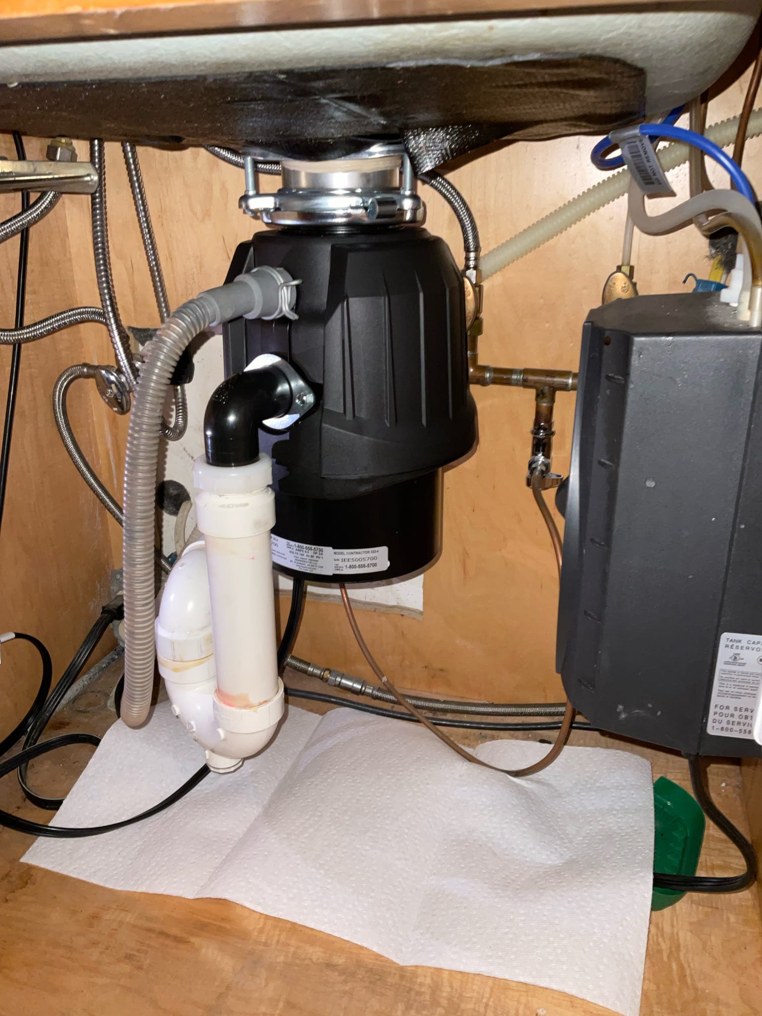 Clean, professional under-sink installation by Akian Plumbing, Heating, Cooling & Electric shows reliable workmanship and thoughtful leak protection.