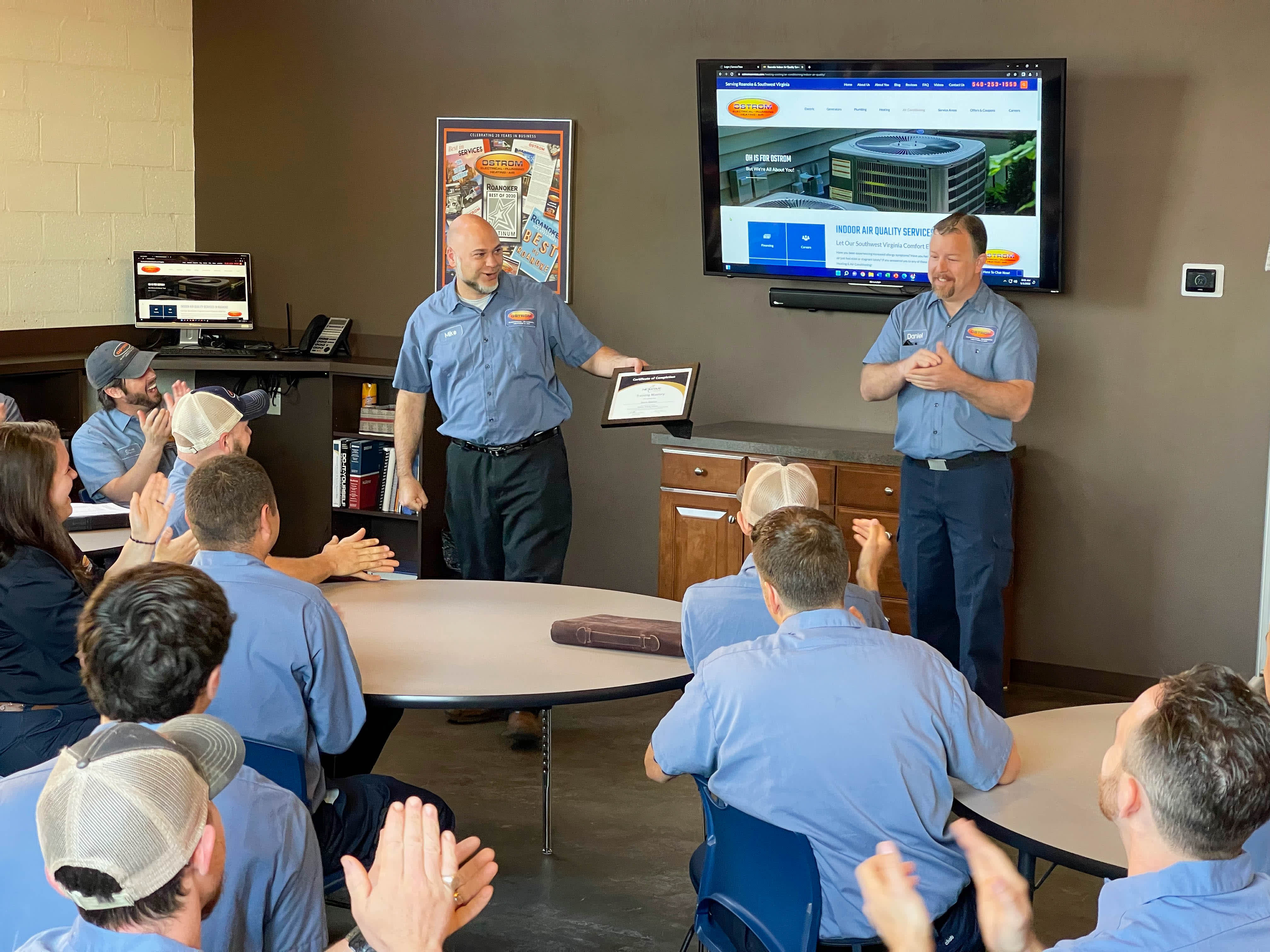 Ostrom Electrical Plumbing Heating & Air Conditioning celebrates teamwork and excellence, showcasing our commitment to quality services.