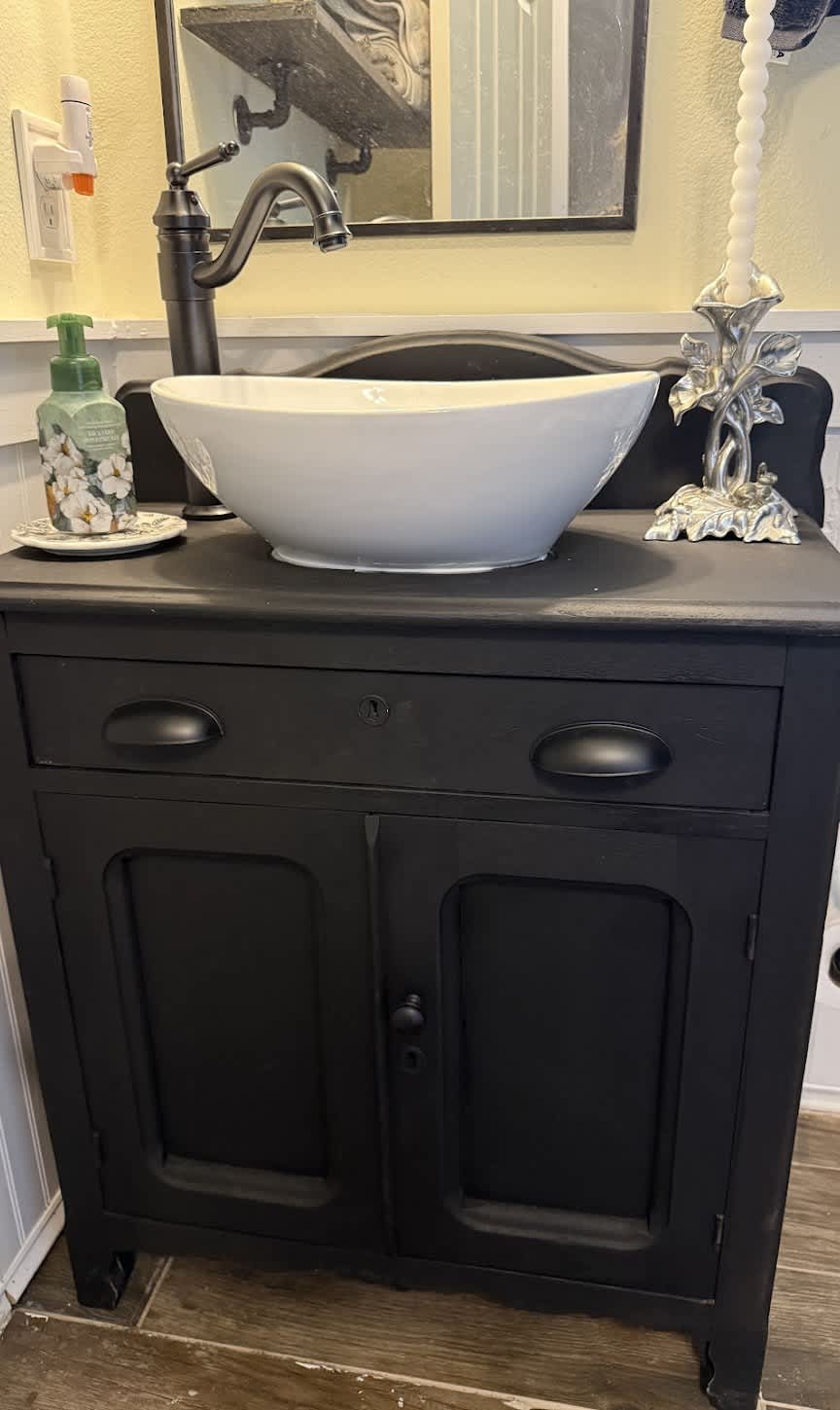 A crisp vessel sink and expertly installed faucet showcase the craftsmanship customers trust from Abacus Plumbing, Air Conditioning, & Electrical.