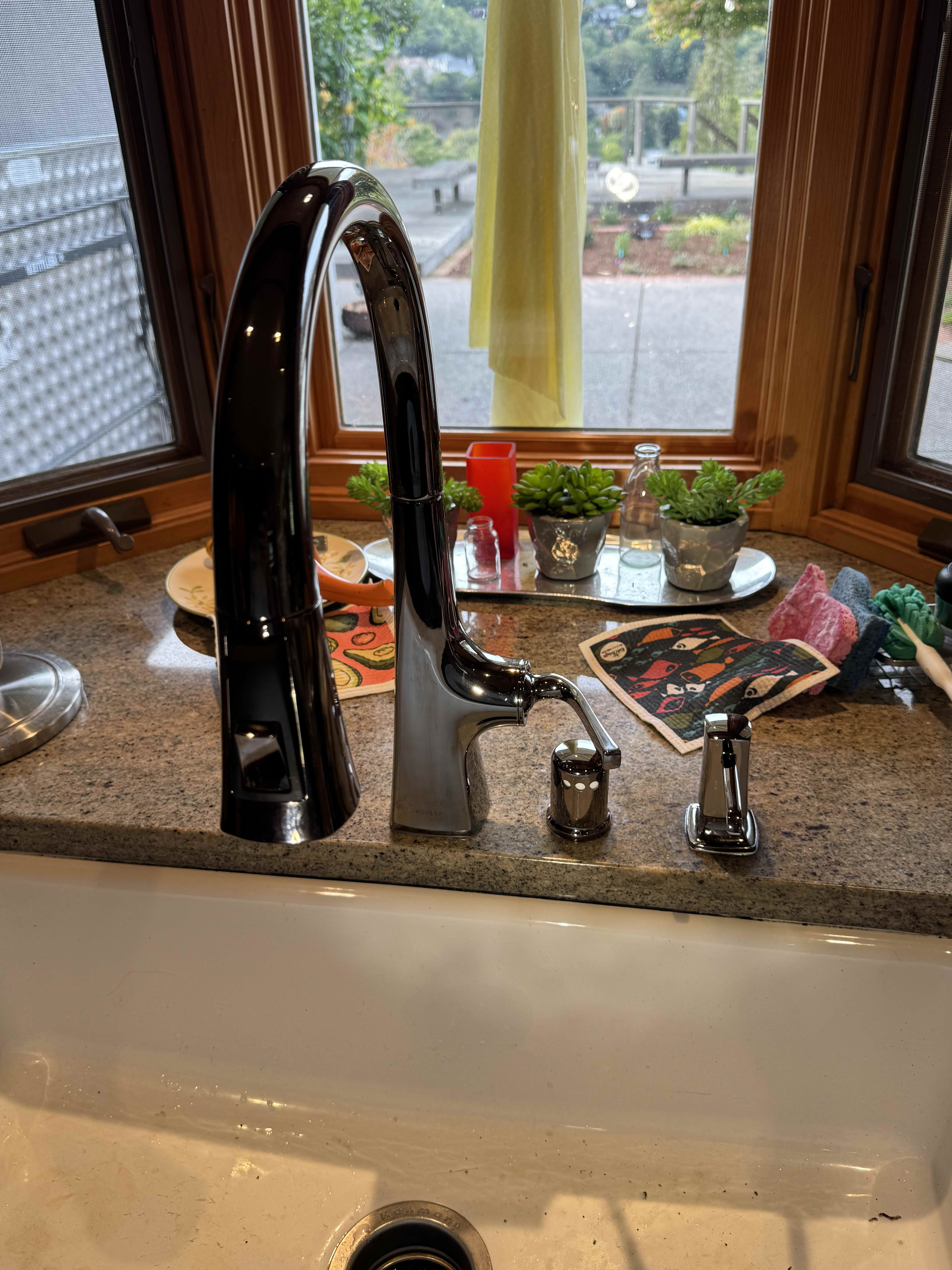 A sleek chrome kitchen faucet installed with care adds lasting value and polished craftsmanship to your home with Big Island Plumbing.