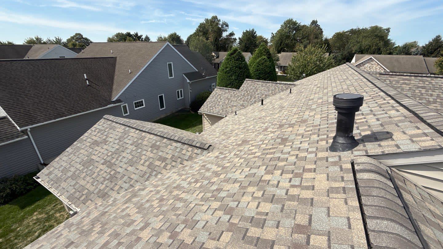 Showcasing durable craftsmanship and attention to detail on a suburban roof, Mosaic Roofing & Exteriors delivers lasting results homeowners trust.